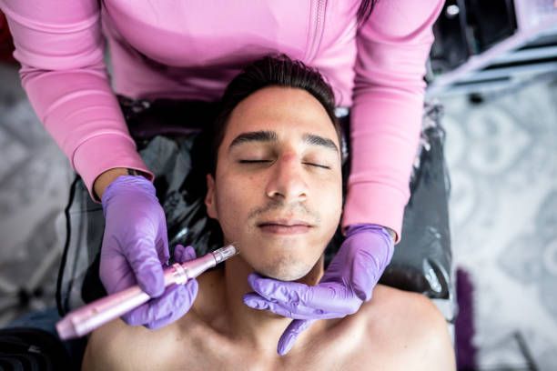 A woman is getting a facial treatment at a beauty salon.