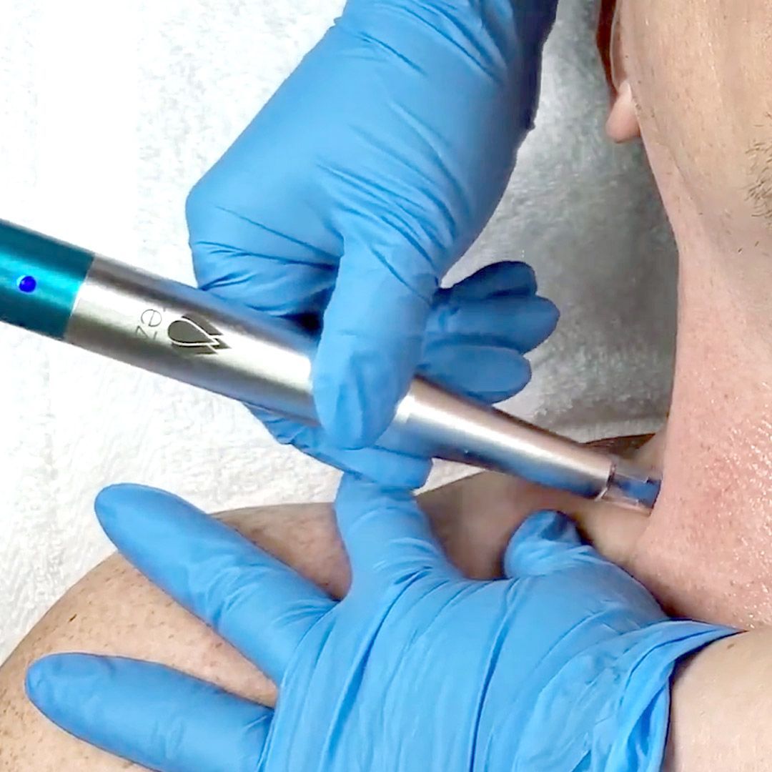 A woman is getting a facial treatment at a beauty salon.