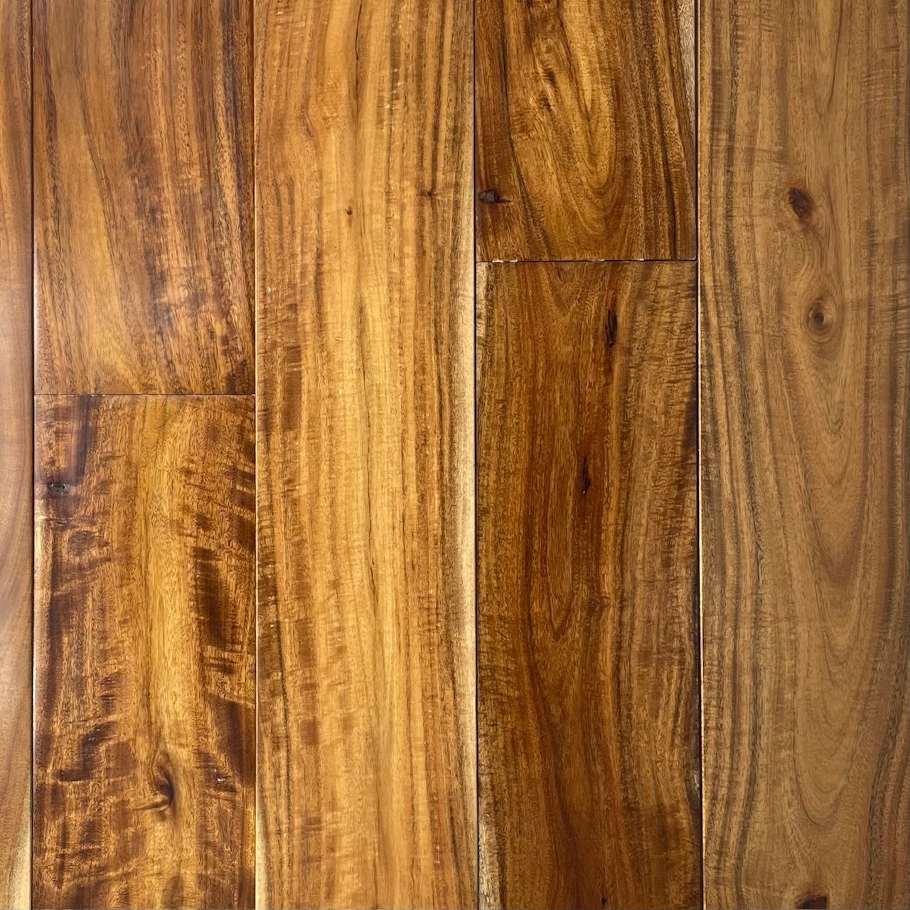 A close up of a wooden floor with a grain and texture.