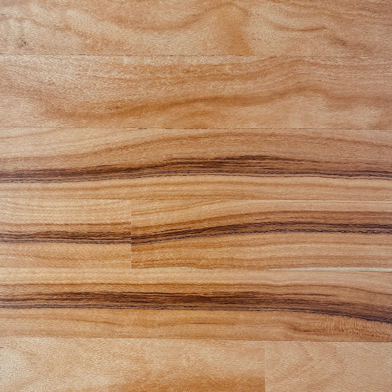 A close up of a piece of wood with a striped pattern.