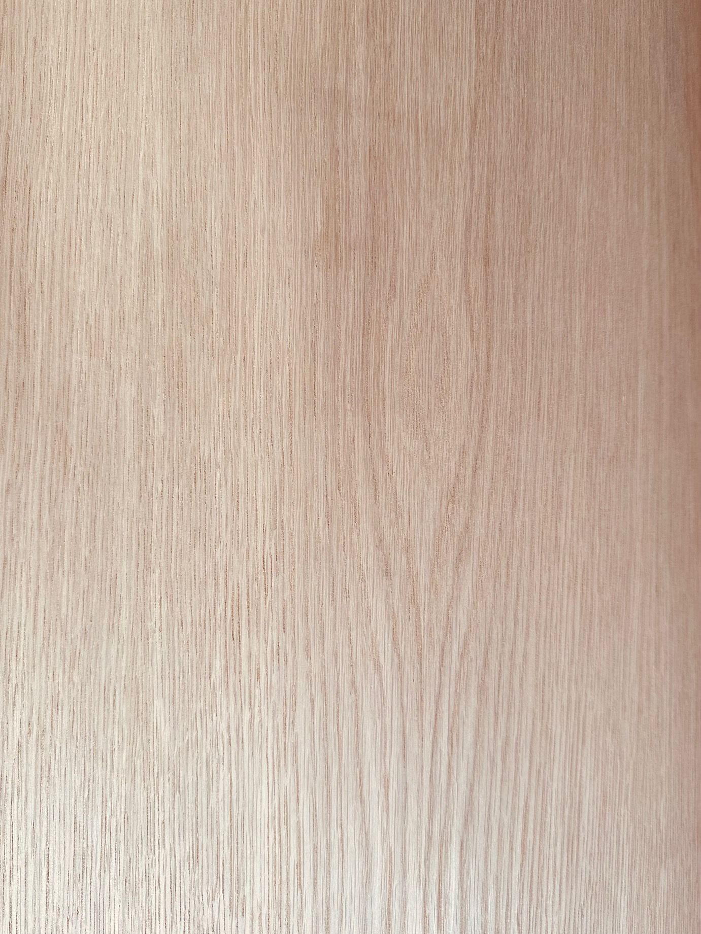 A close up of a piece of wood with a grainy texture.