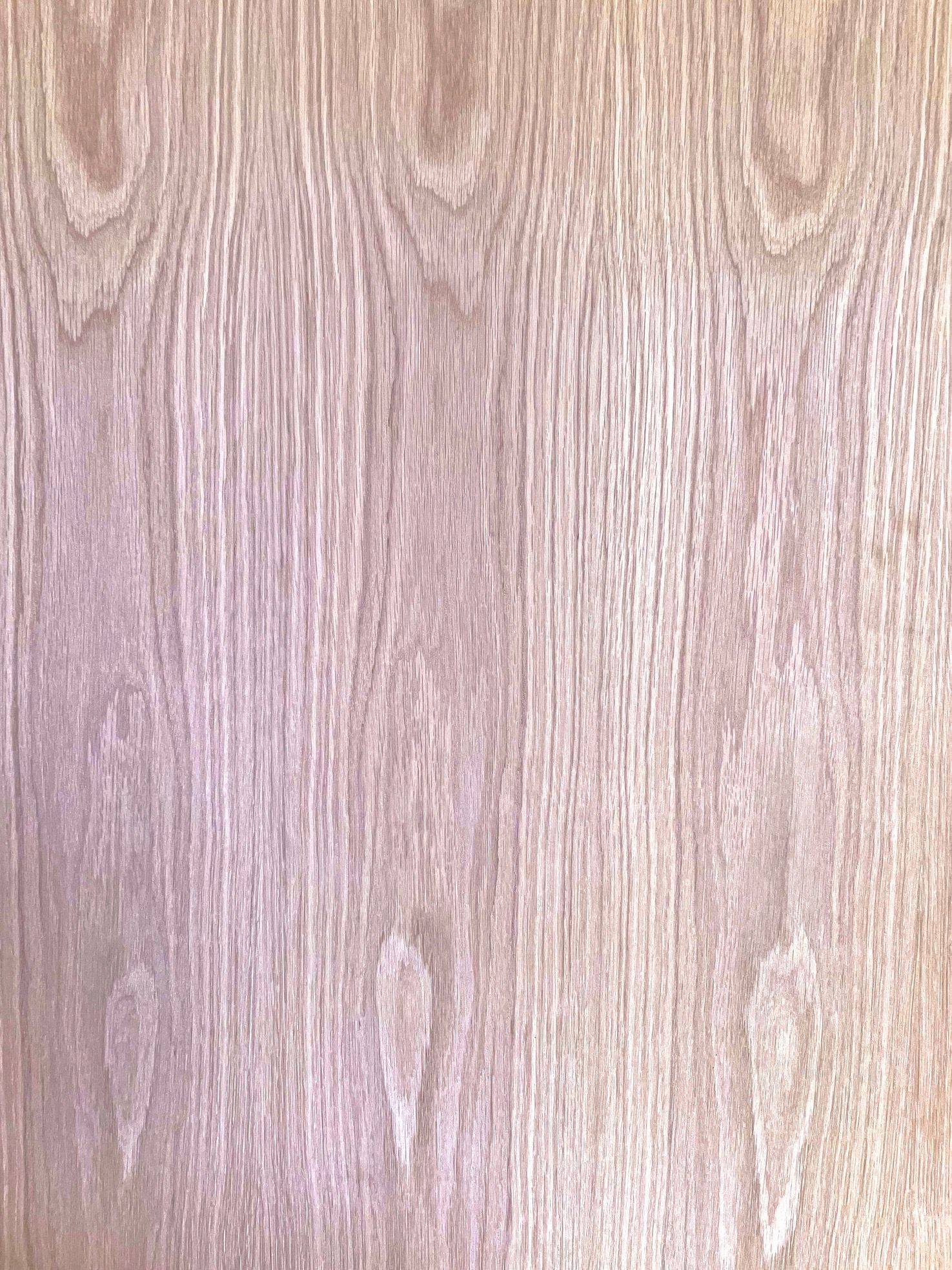 A close up of a piece of wood with a grain pattern.