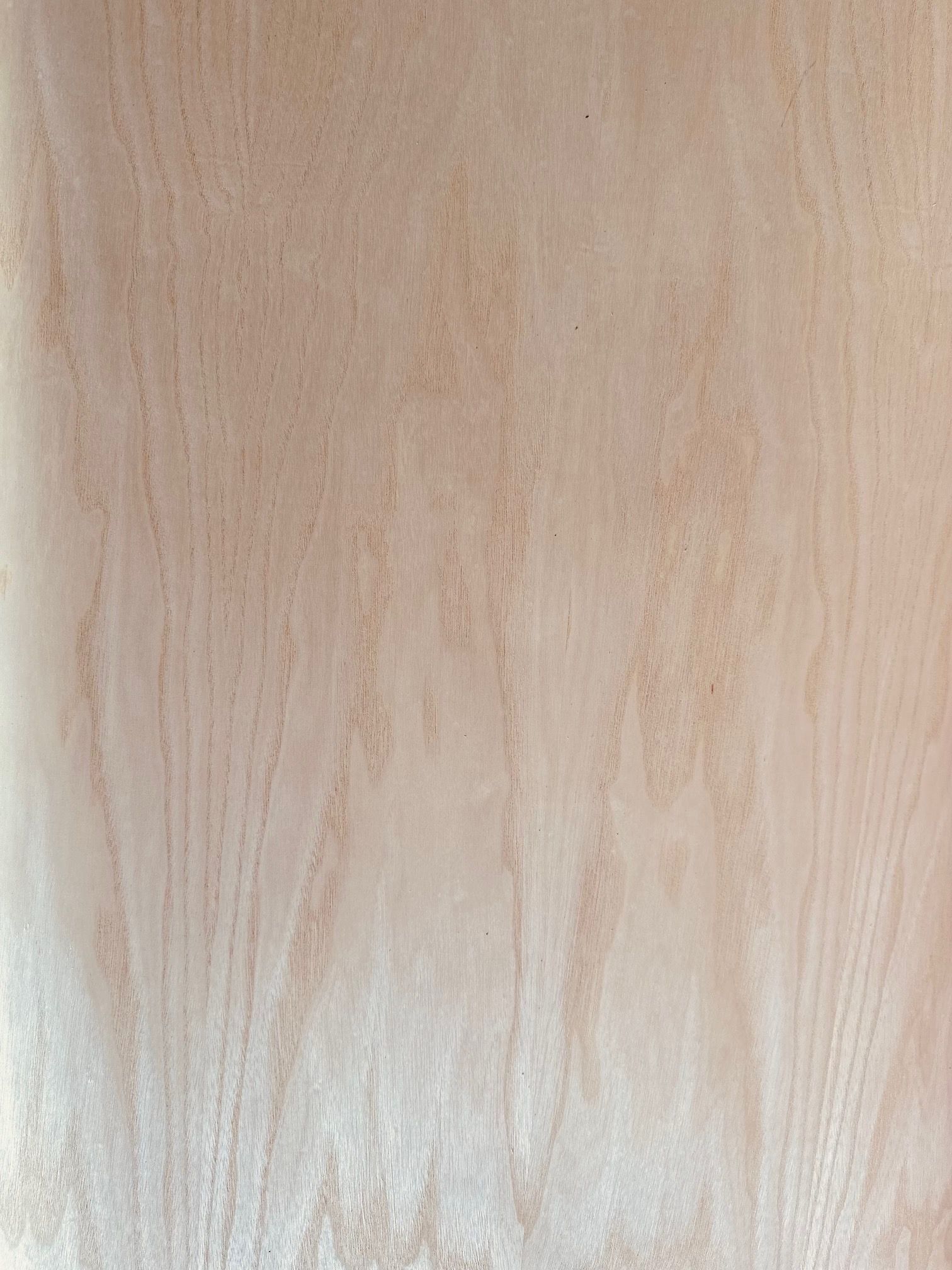 A close up of a piece of wood with a grainy texture.