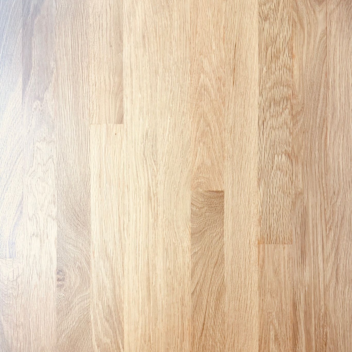 A close up of a wooden table with a grainy texture.