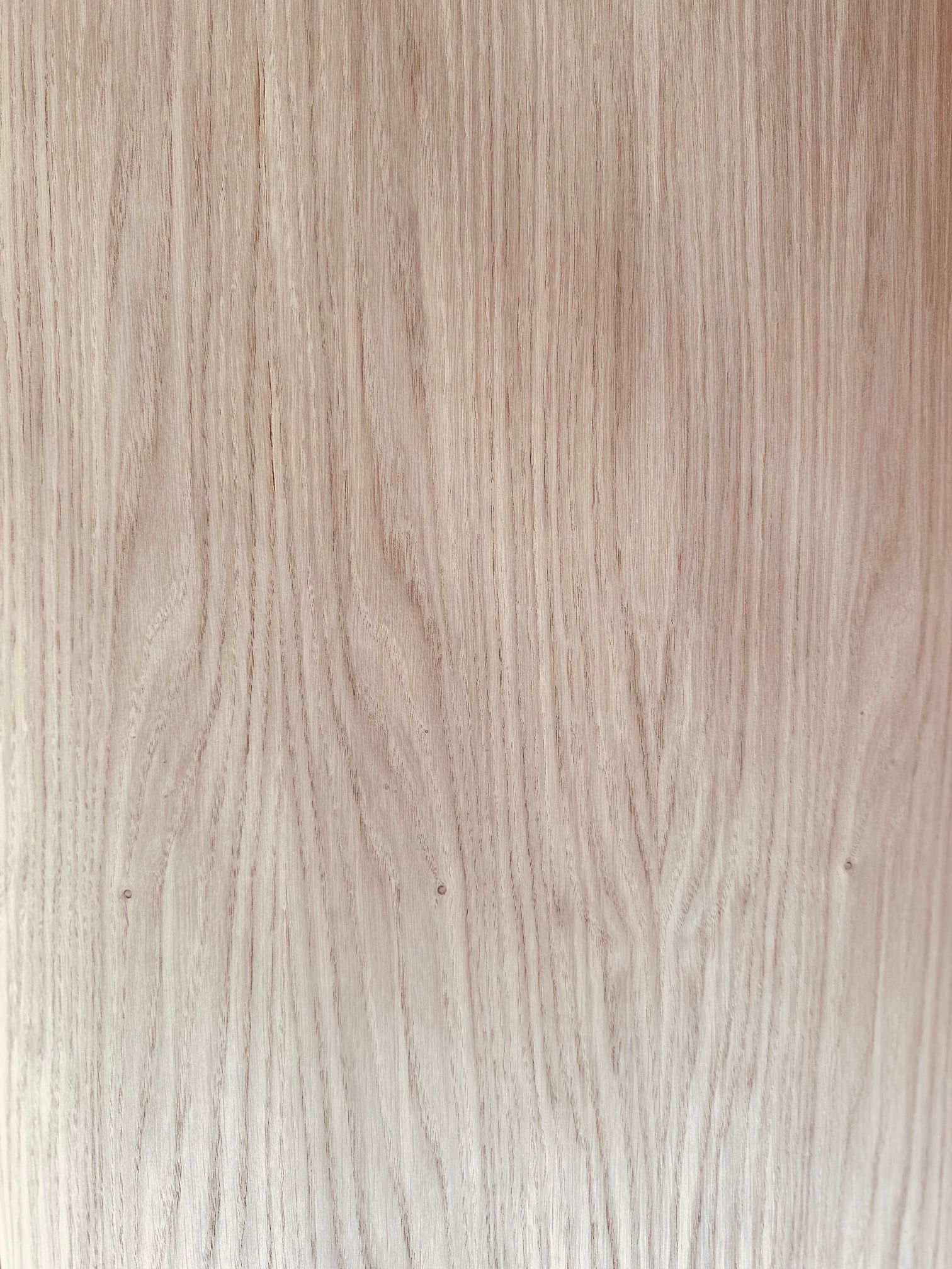 A close up of a piece of wood showing the grain of the wood.