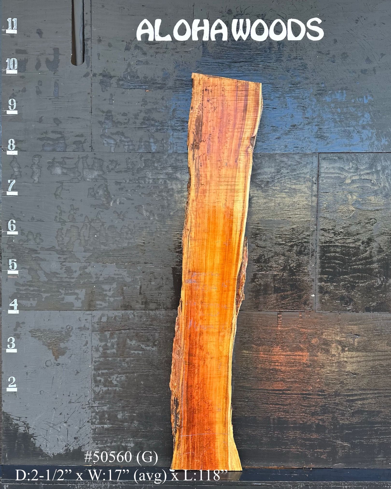 A piece of wood with the words alohawoods on it