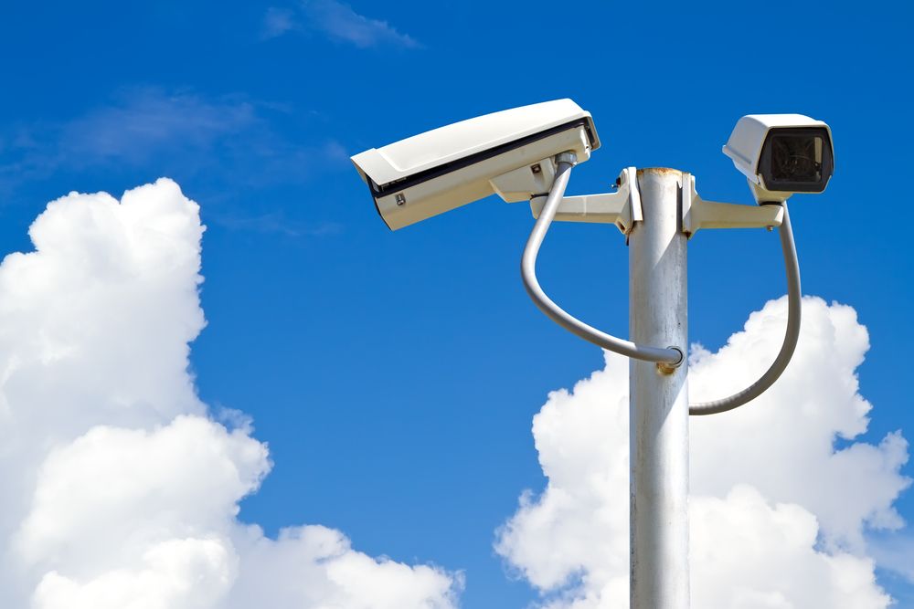 Two White Security Cameras on a Silver Pole — NQ Video Surveillance in Mareeba, QLD

