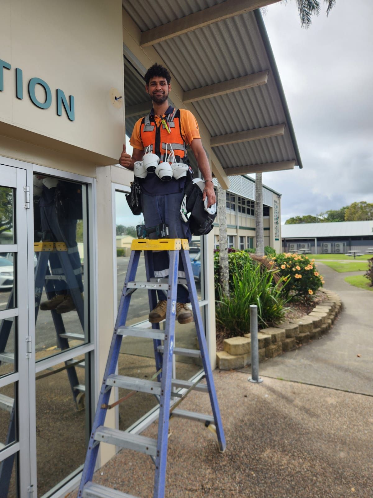 Person in Blue Shirt Monitoring Multiple Security Camera — NQ Video Surveillance in Bungalow, QLD