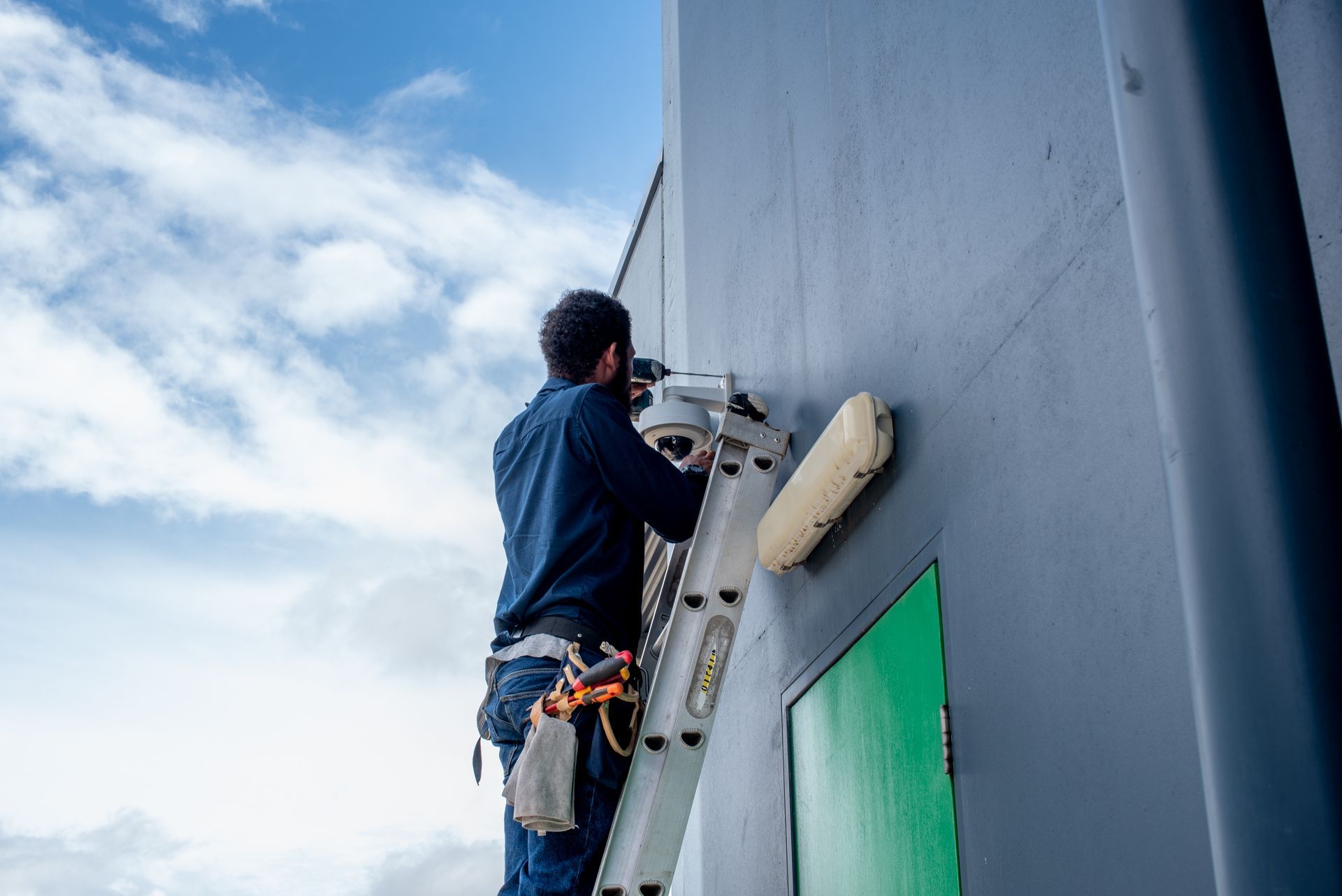 White Security Camera Mounted on a Metal Pole — NQ Video Surveillance in Bungalow, QLD