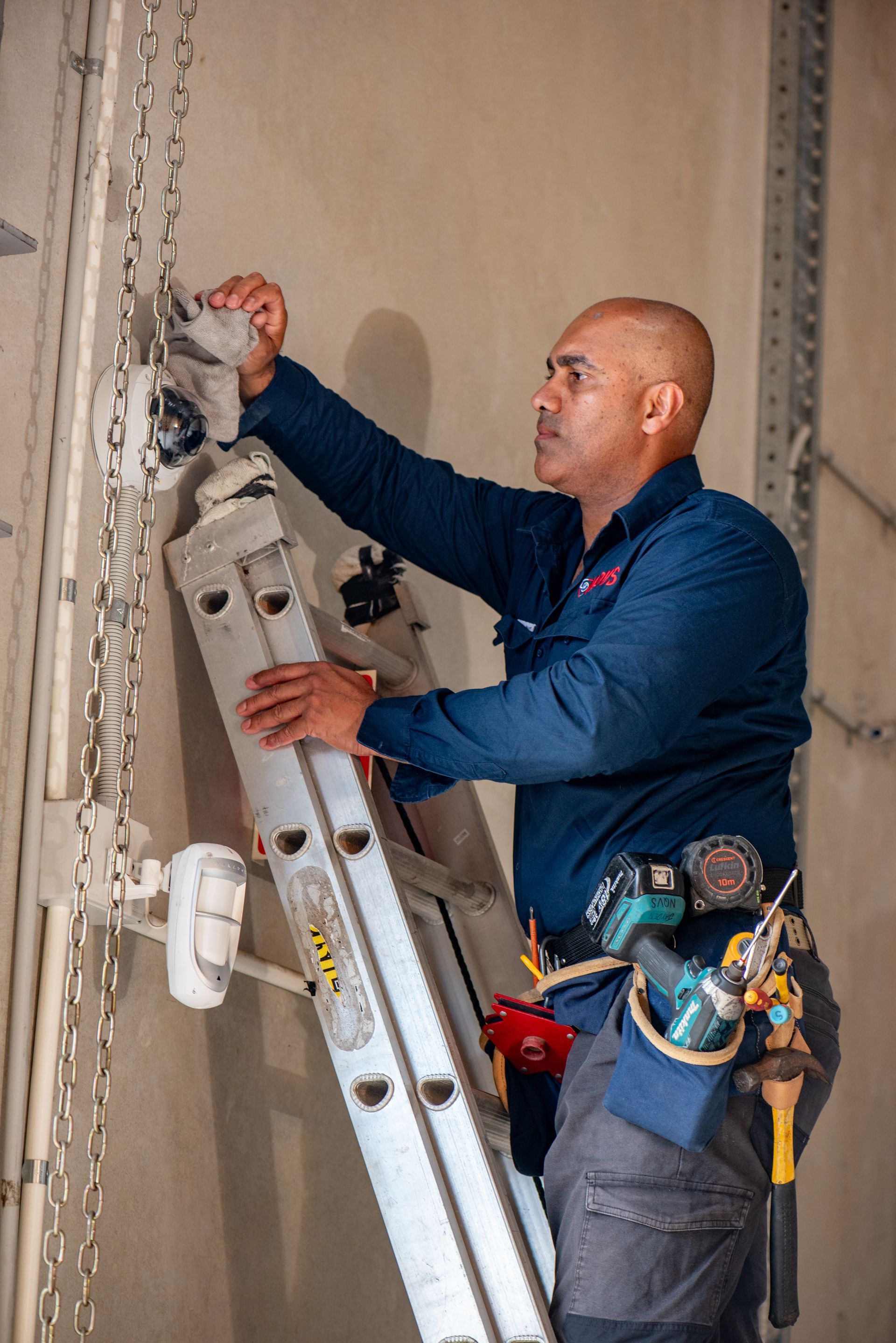 Person Holding Drone Remote With Drone in Background on Rocky Terrain — NQ Video Surveillance in Bungalow, QLD