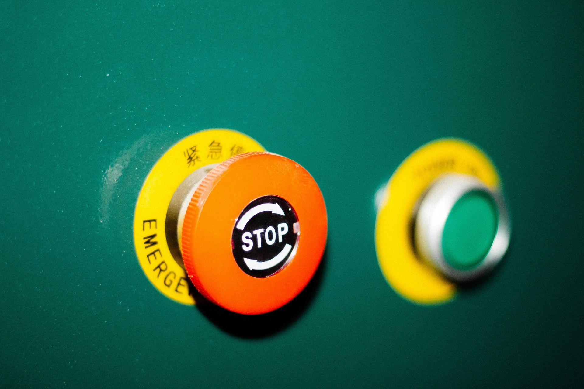 Close-up of a Green Surface With a Emergency Button — NQ Video Surveillance in Townsville, QLD