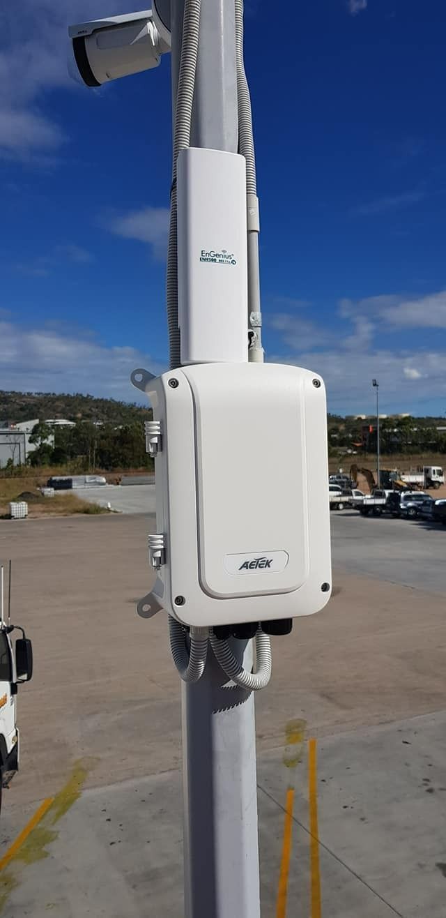 A White Security Camera and Equipment Mounted on a Tall Pole — NQ Video Surveillance in Mission Beach, QLD