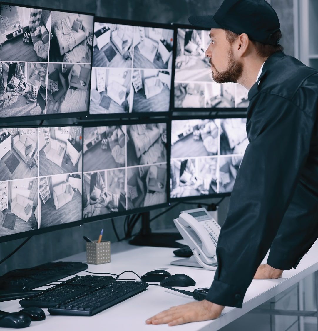 Security Guard Monitoring Surveillance Screens in a Control Room — NQ Video Surveillance in Bungalow, QLD