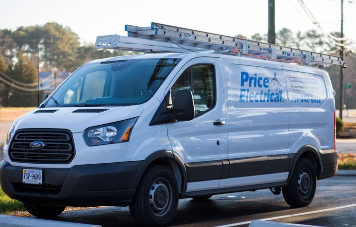 A price electrical van is parked on the side of the road.