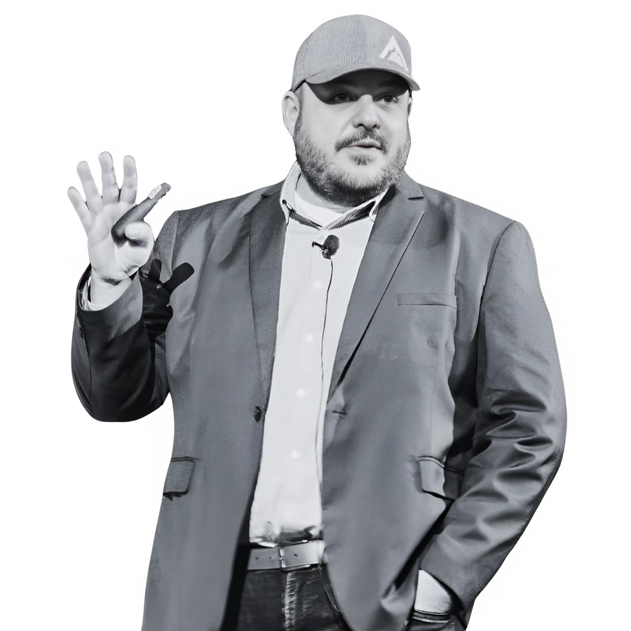 A man in a suit and hat is giving the ok sign