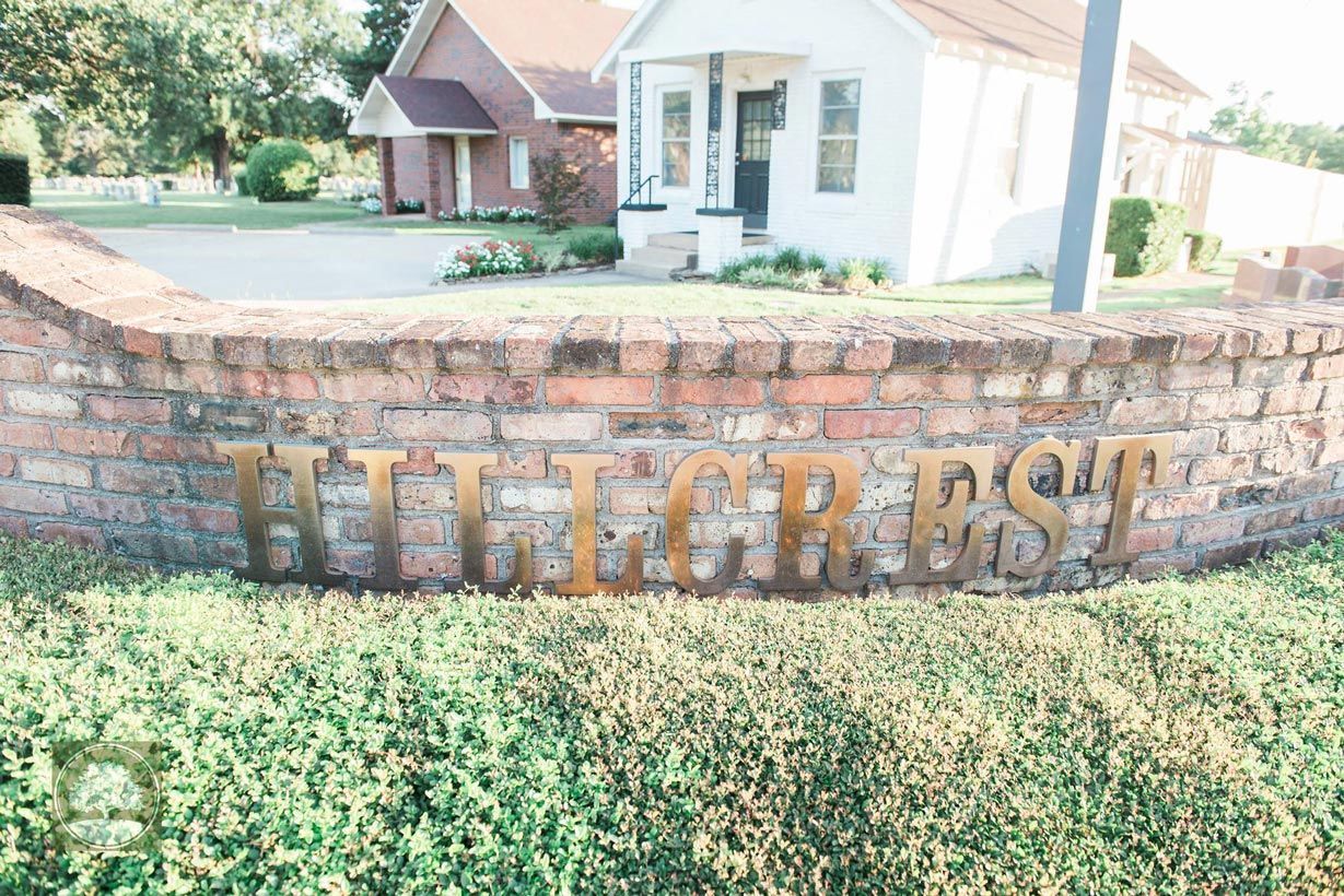 A brick wall with the words high crest written on it.