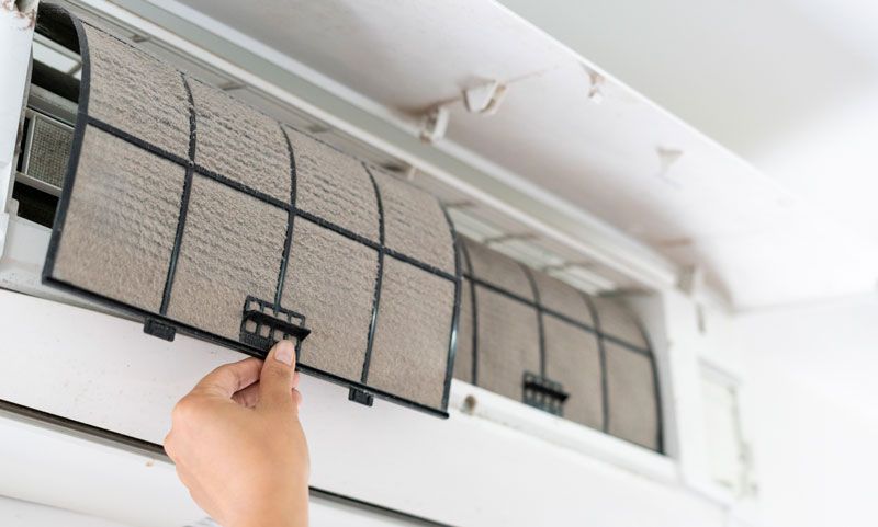 Removing Air Conditioner Filter — Castle Hill, NSW — Brennan Air Conditioning Pty Ltd