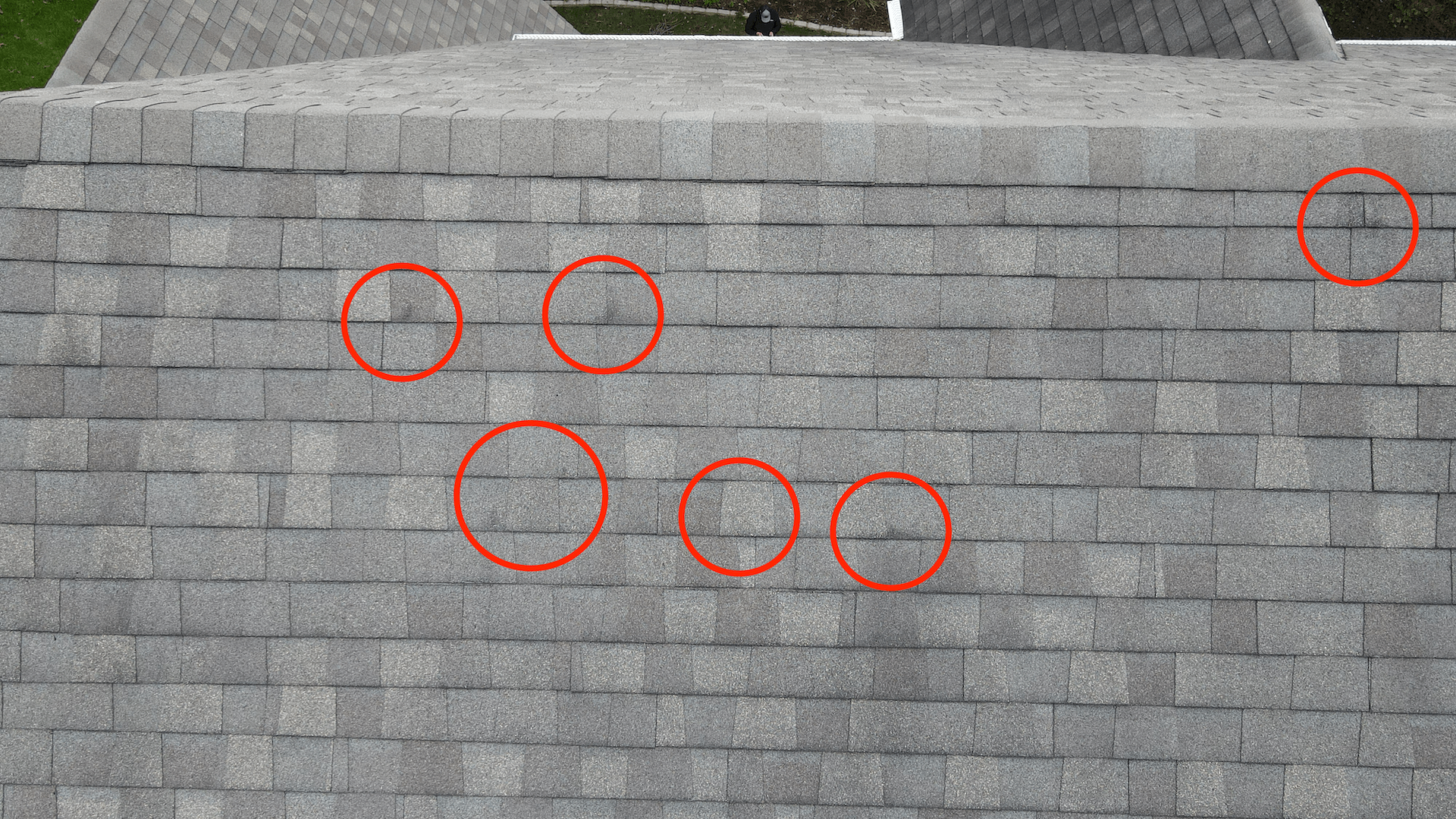 Image of a Moseley VA 23120 roof damaged by hail, with circle graphics around the damaged spots.