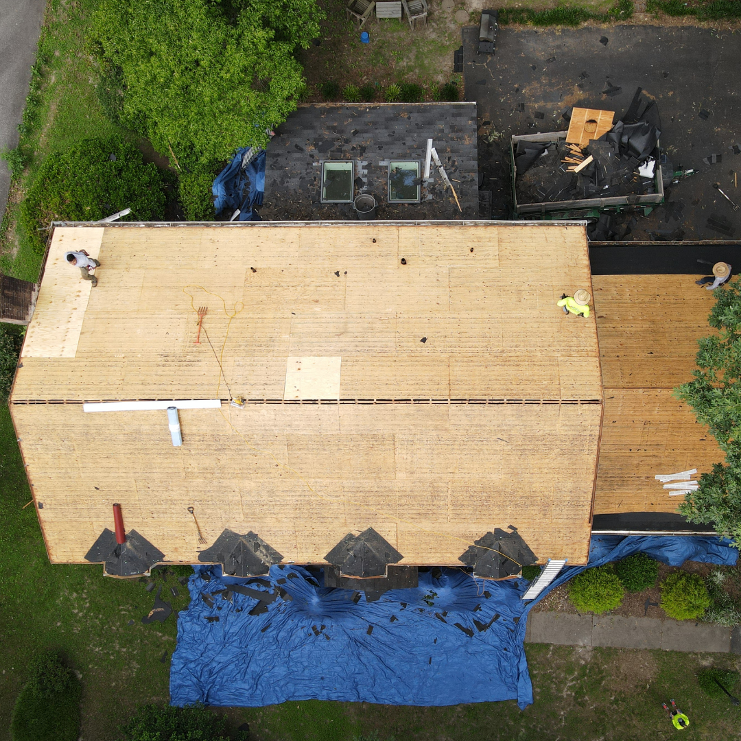 A drone image of a RETEX roof replacement in North Chesterfield VA 23235. Image shows damaged plywood replacement step.