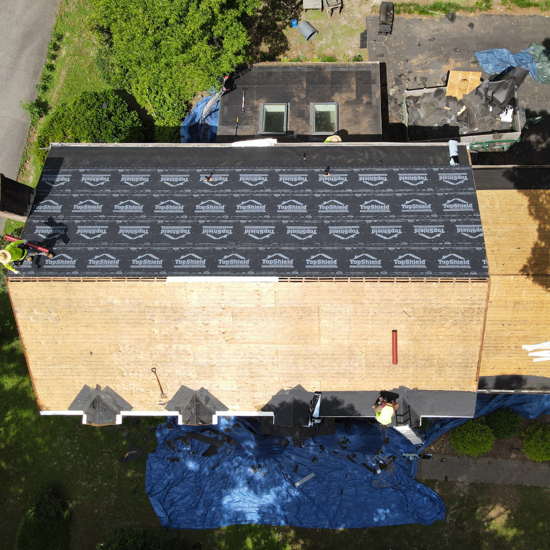 A drone image of a RETEX roof replacement in North Chesterfield VA 23235. Image shows underlayment installation step.