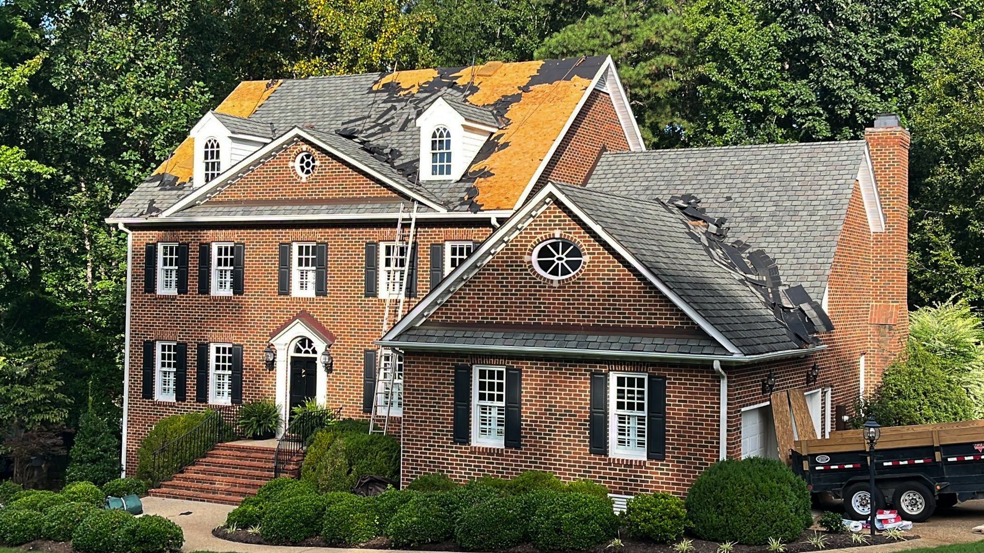 A during-tear-off image of a RETEX roof replacement in Midlothian, VA 23113.