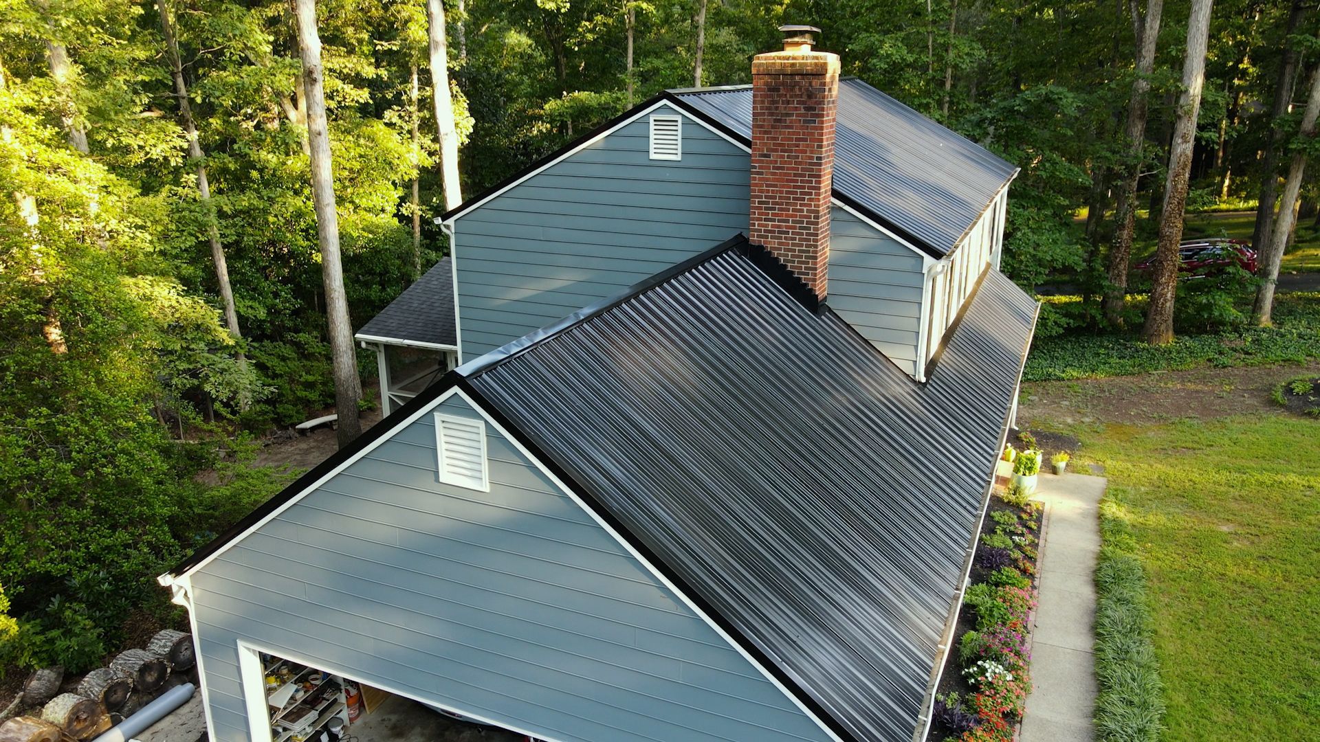 Drone image of RETEX black ribbed metal roof installation in North Chesterfield VA 23235.