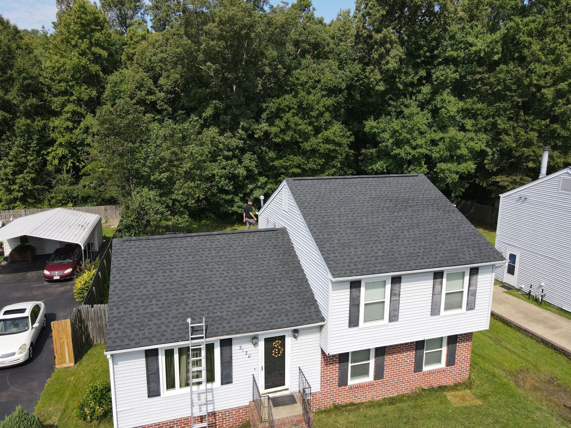 Drone image of RETEX's Caleb Kammerling inspecting a RETEX roof replacement in Richmond VA.