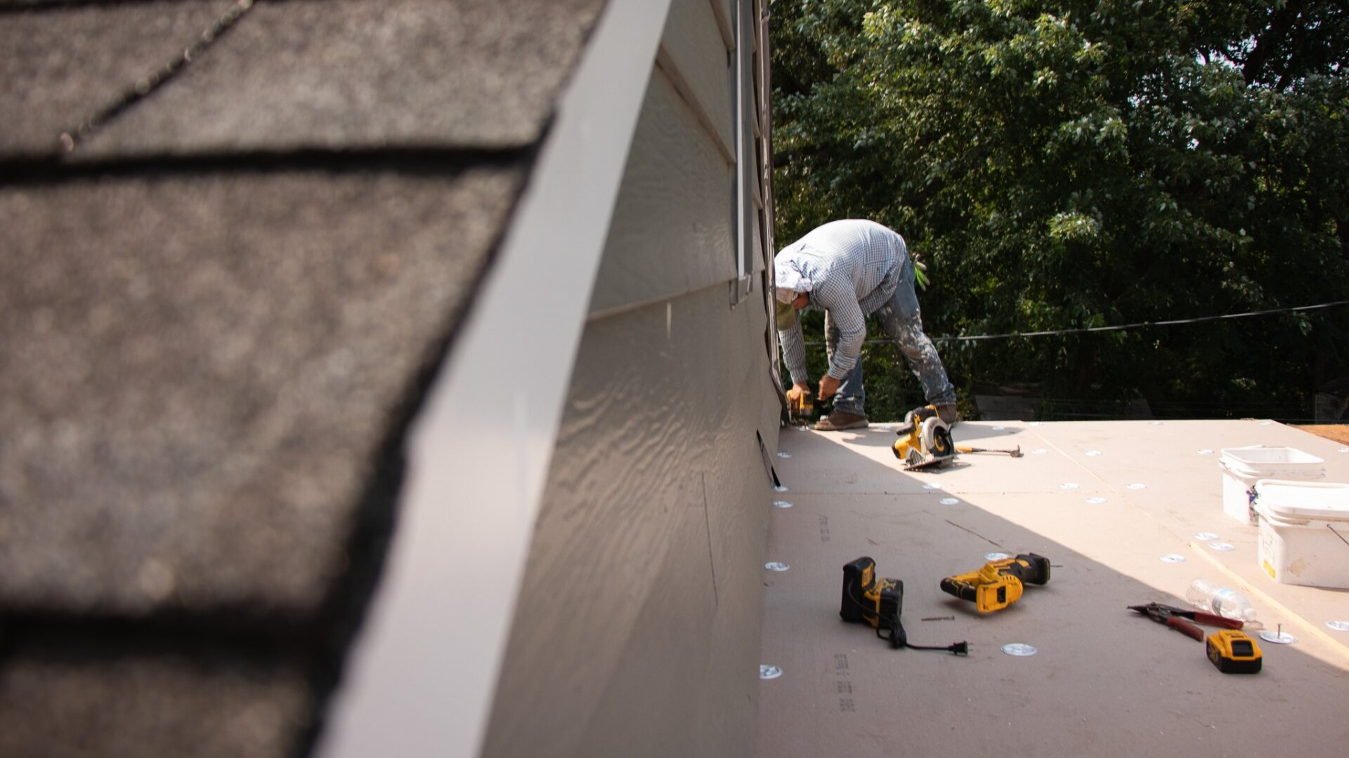 RETEX crew member installing new TPO roof in Richmond VA. Image captured by RETEX's Katelyn Lewis.