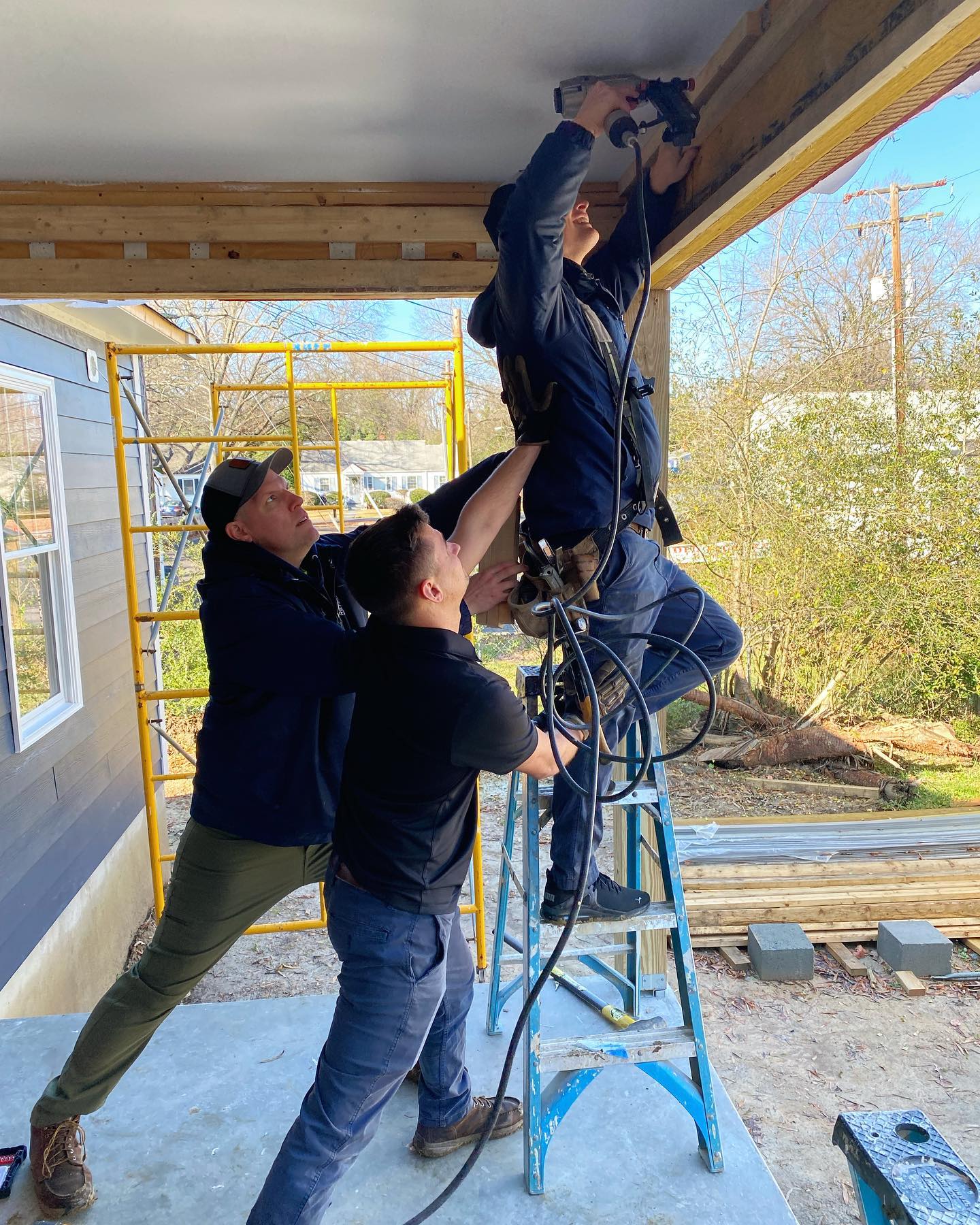 RETEX’s Mark Erickson, Caleb Kammerling and Caleb Hennon volunteering with Richmond Habitat for Humanity in December 2022.