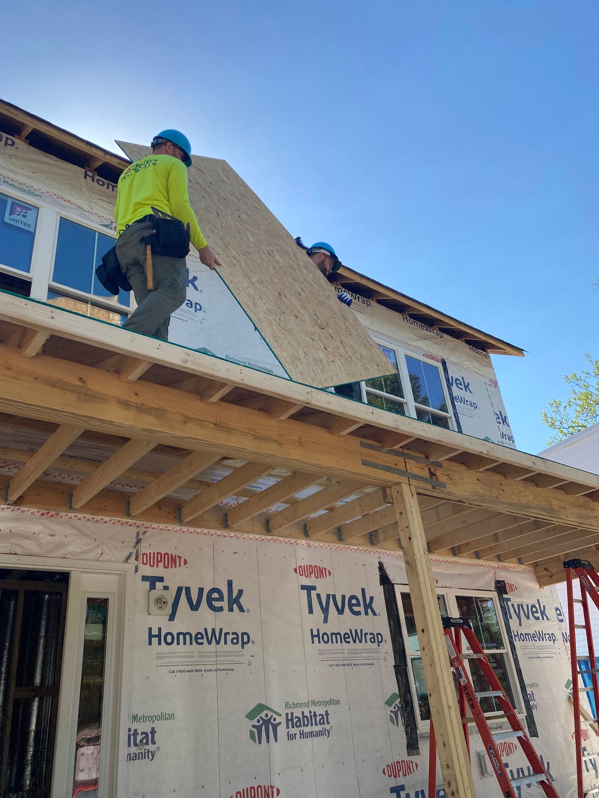 Image of RETEX’s Josh Lewis and Andy Connor volunteering with Richmond Habitat for Humanity in April 2023.