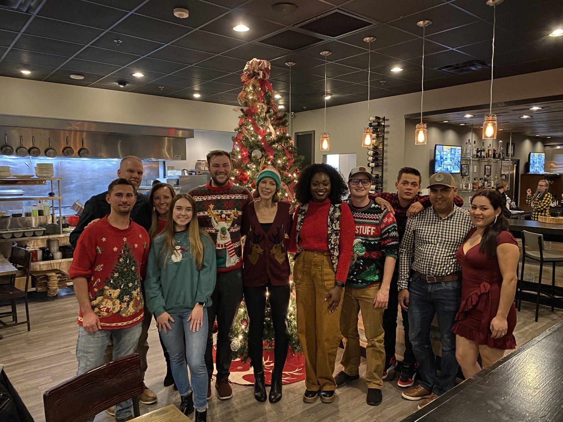 Photo of the RETEX team and their significant others during our team holiday dinner in December 2021.