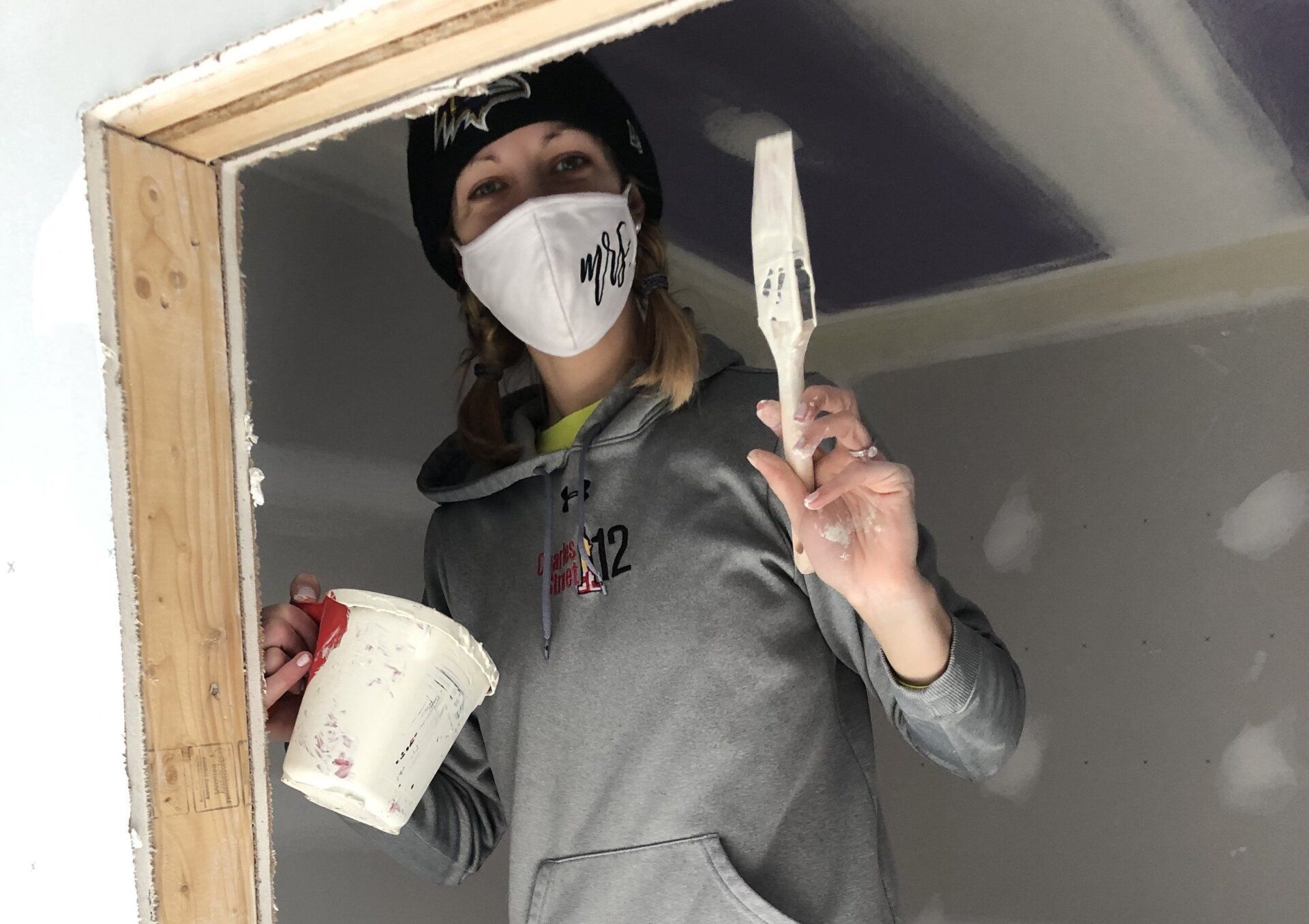 Image of RETEX's Katelyn Lewis volunteering by painting at Richmond Habitat for Humanity in January 2022.