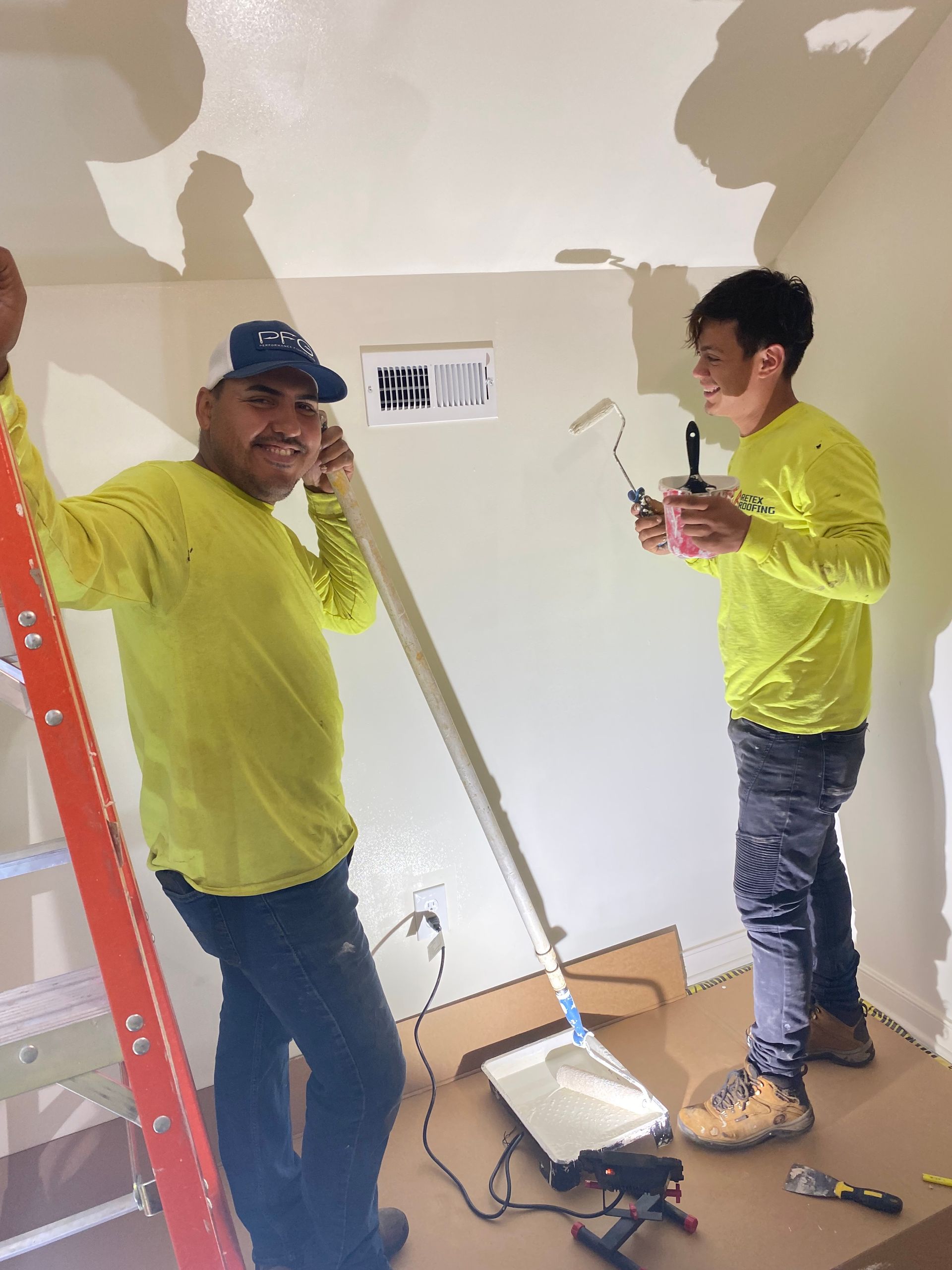Image of RETEX's Julio Castillo-Marin and Bryan Rizo volunteering at Richmond Habitat for Humanity in February 2023.