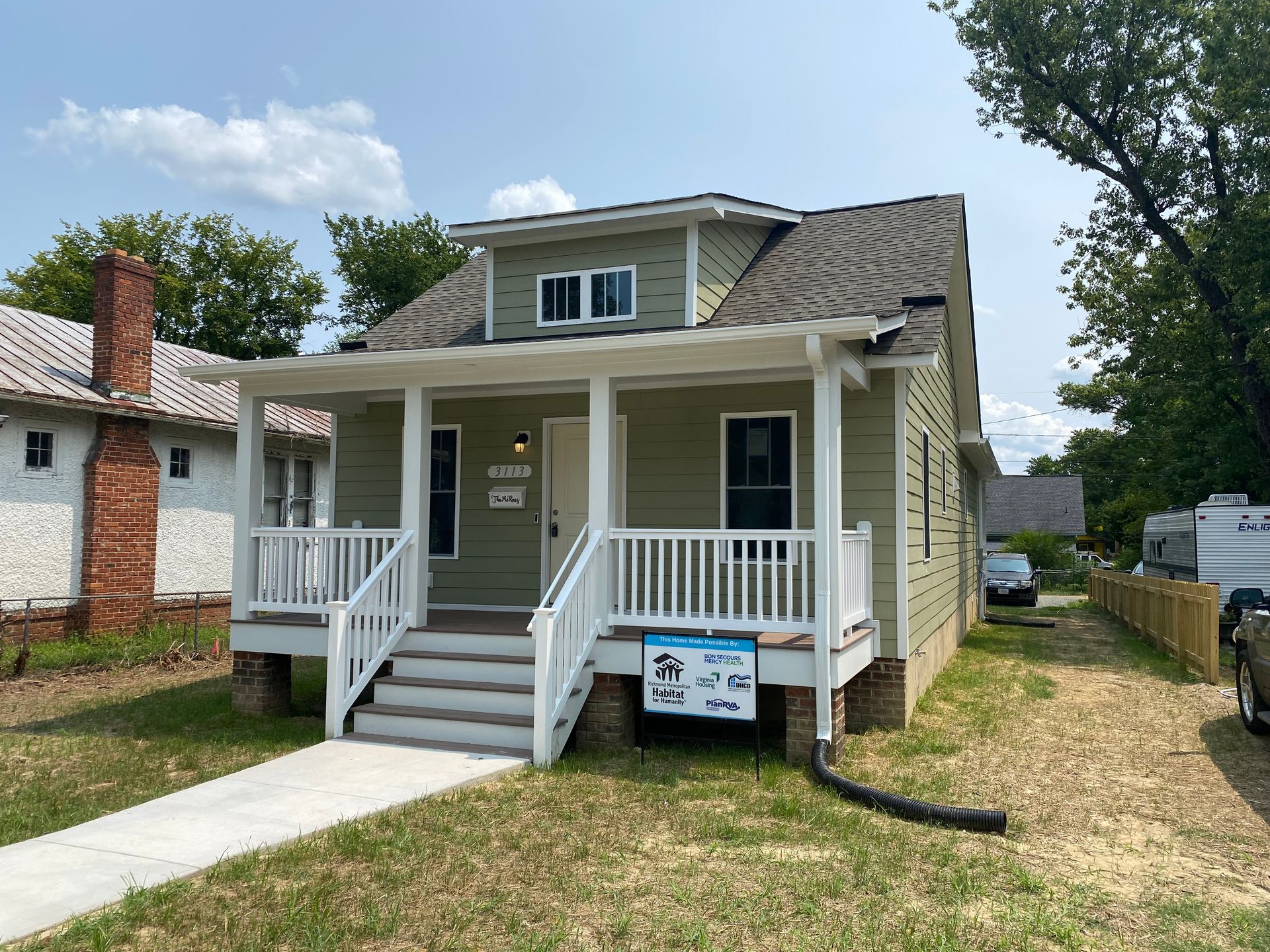 Image of completed job site at Richmond Habitat for Humanity home dedication ceremony.