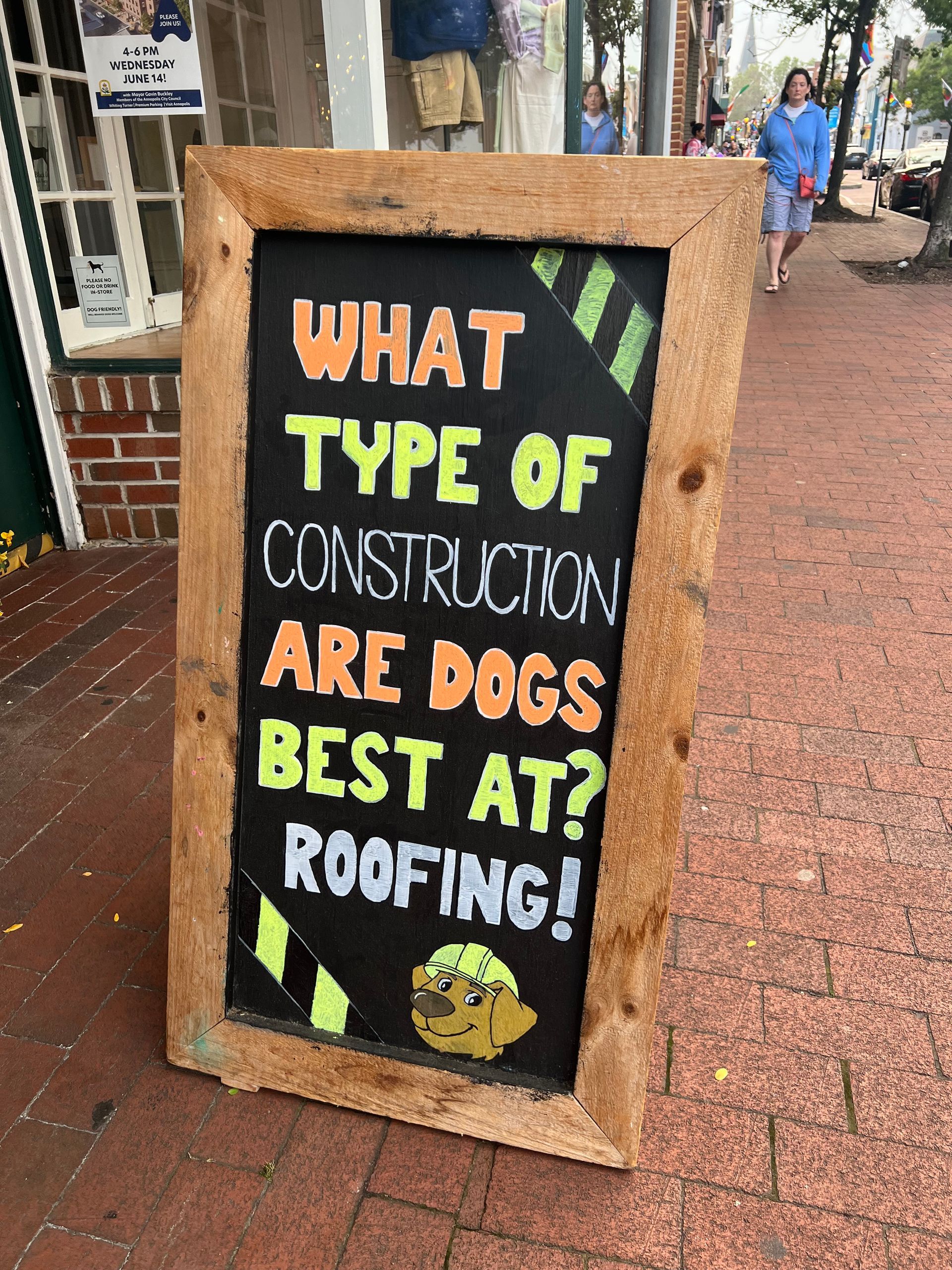 Image of a chalkboard sign that reads: What type of construction are dogs best at? Roofing!