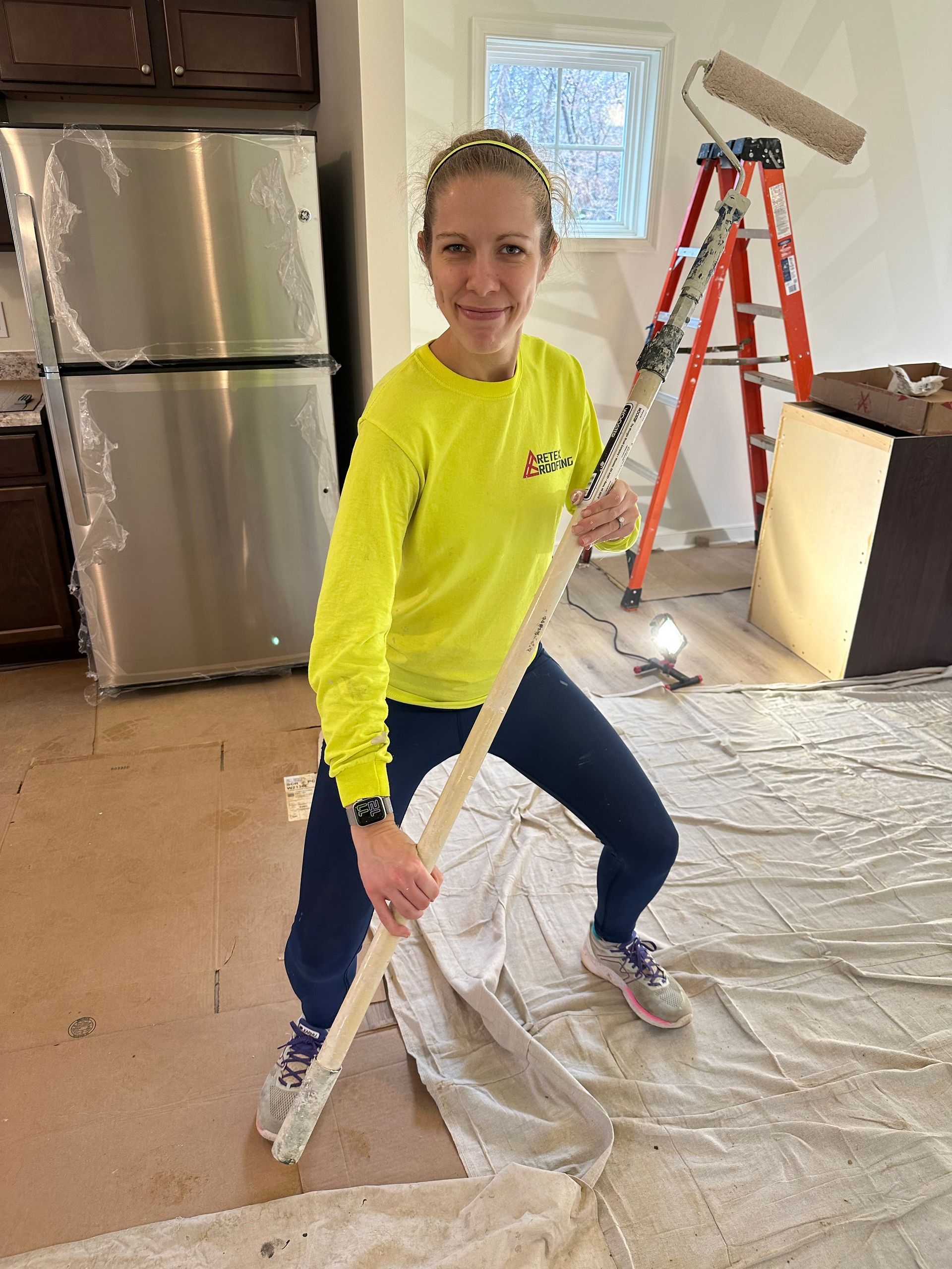 Image of RETEX's Katelyn Lewis volunteering by painting at Richmond Habitat for Humanity in January 2022.