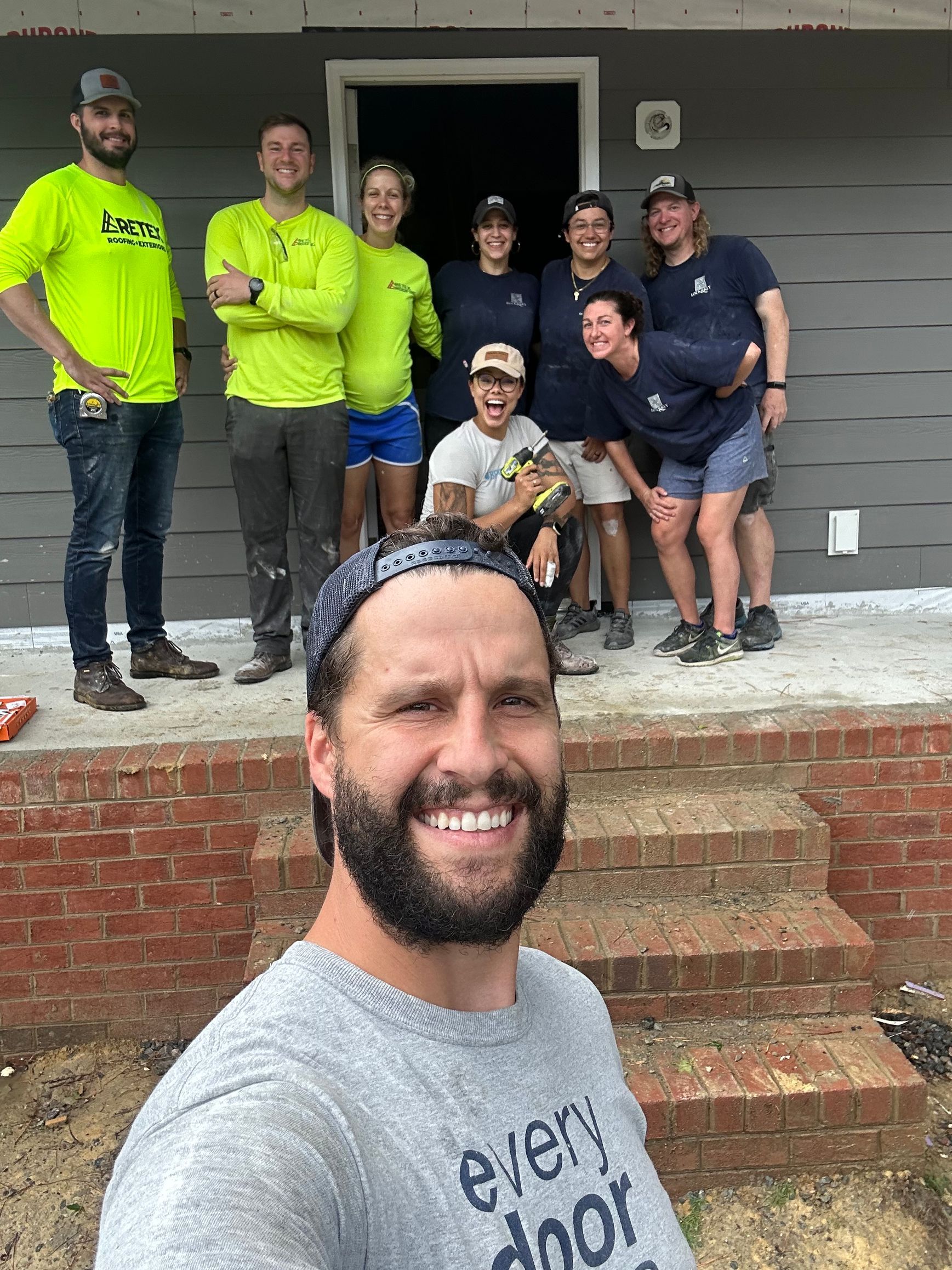 Image of RETEX's John Gordon, Josh and Katelyn Lewis volunteering with Lock & Key Realty at Richmond Habitat in June 2023.