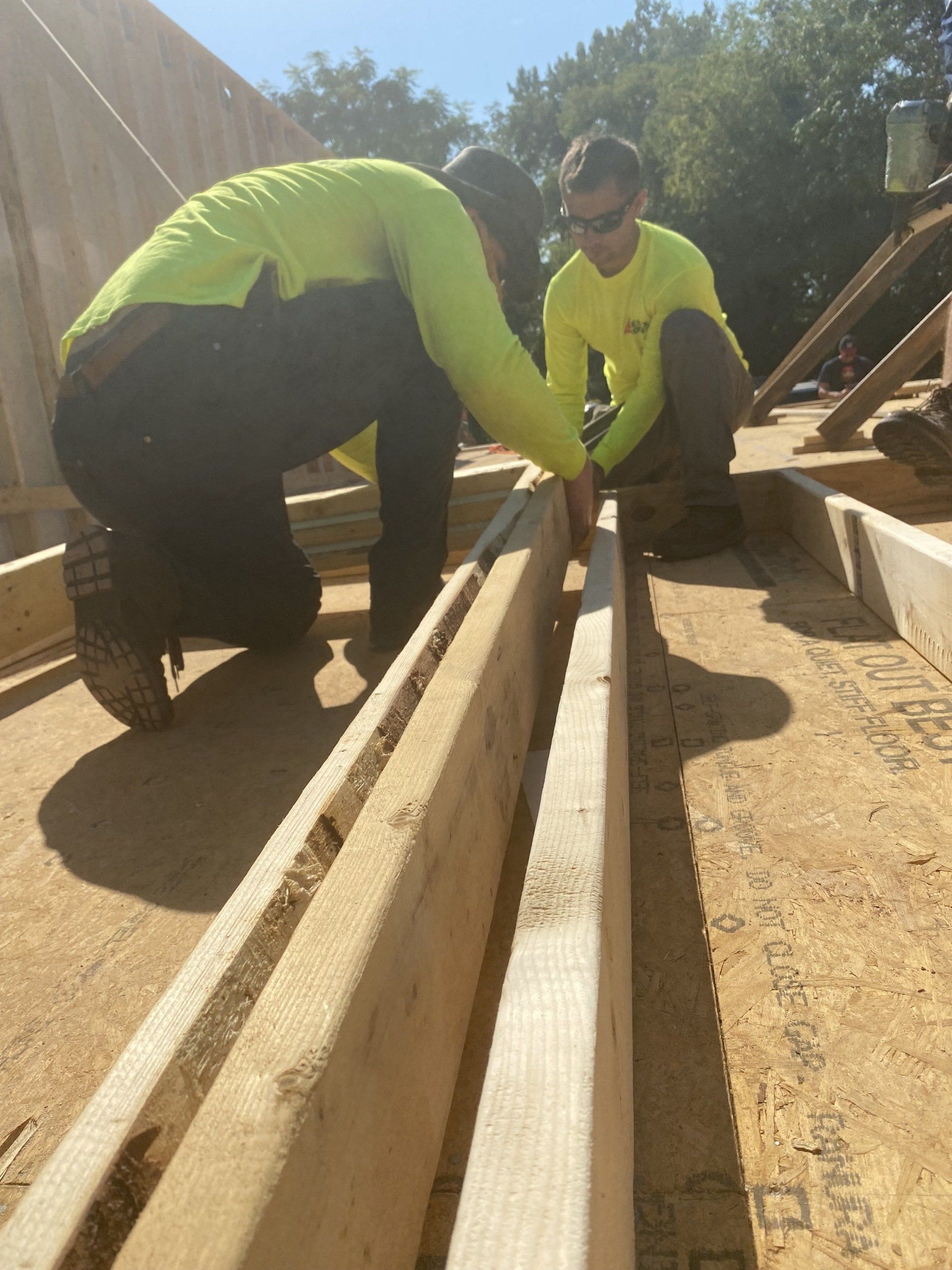 Image of RETEX's Josh Lewis and Caleb Kammerling building out framing for a Richmond Habitat for Humanity home.