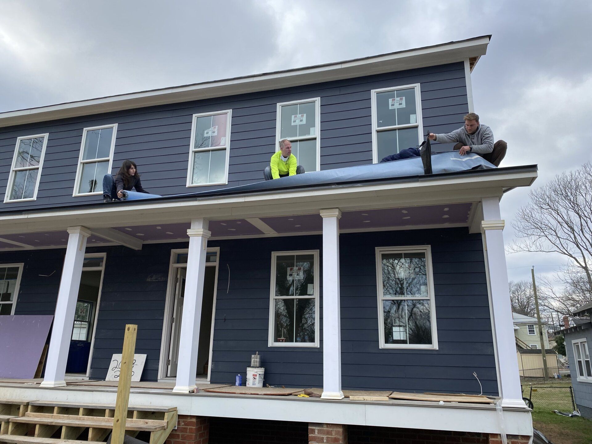 Image of RETEX's Josh Lewis and Mark Erickson volunteering at Richmond Habitat for Humanity in January 2022.