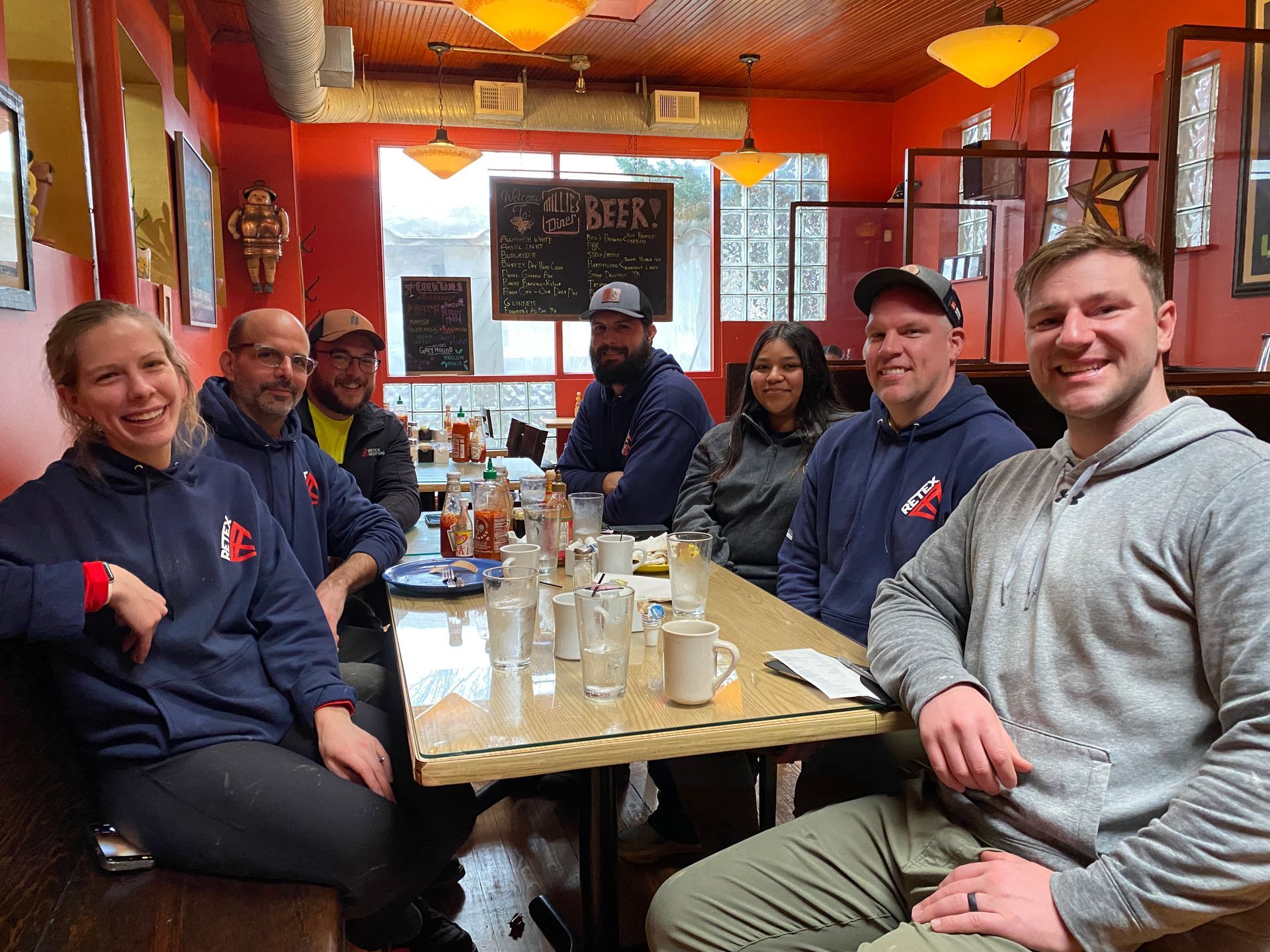 Image of the RETEX Richmond team at lunch after a Richmond Habitat for Humanity volunteer day in February 2024.