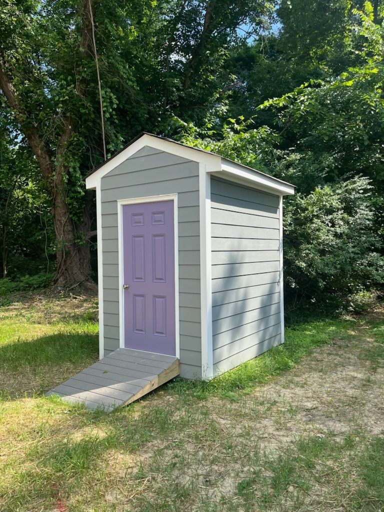 Image of shed RETEX team members installed siding for during Richmond Habitat for Humanity volunteer day.