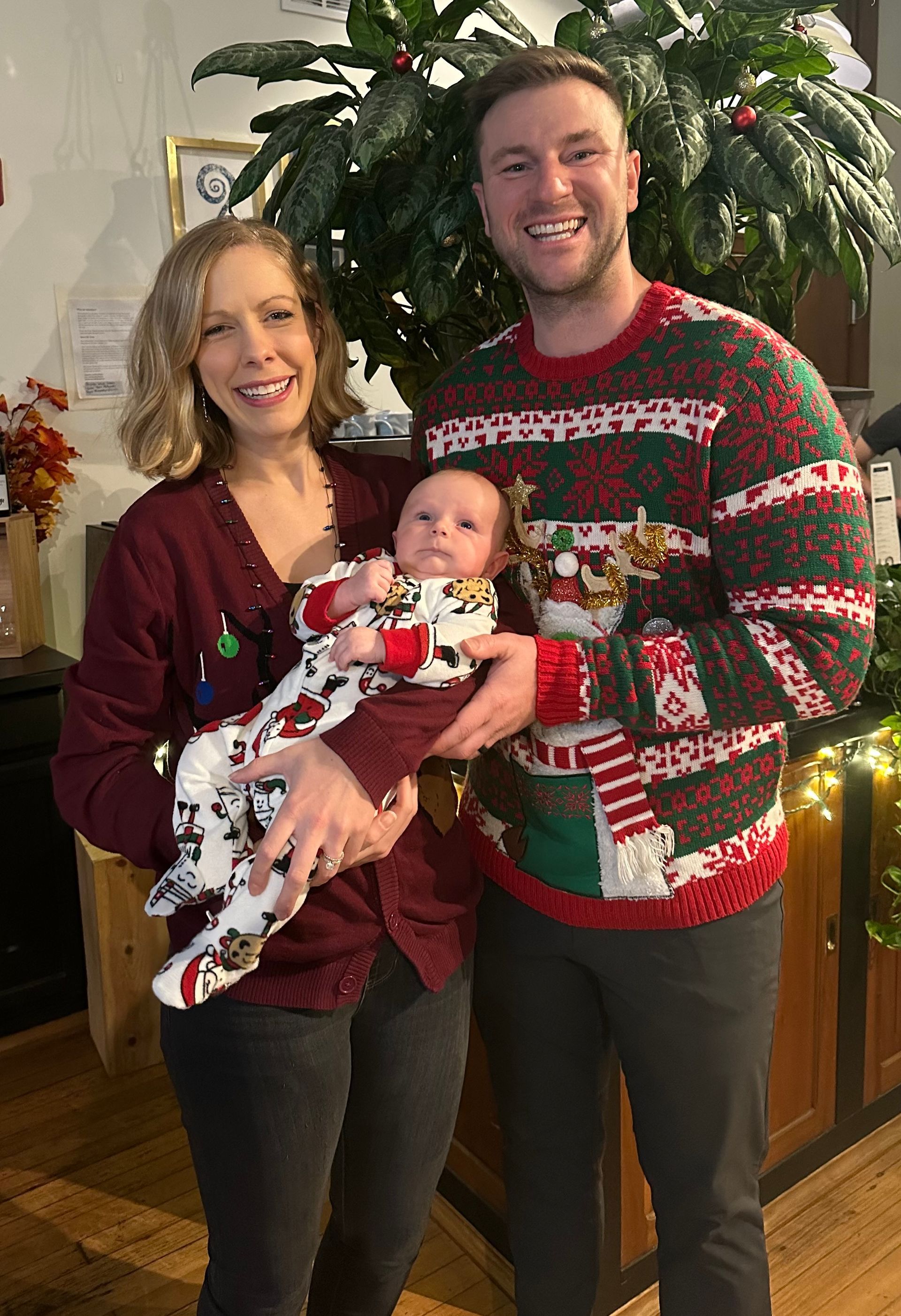 Image of RETEX 's Josh, Katelyn, and Will Lewis during team holiday dinner in December 2023.
