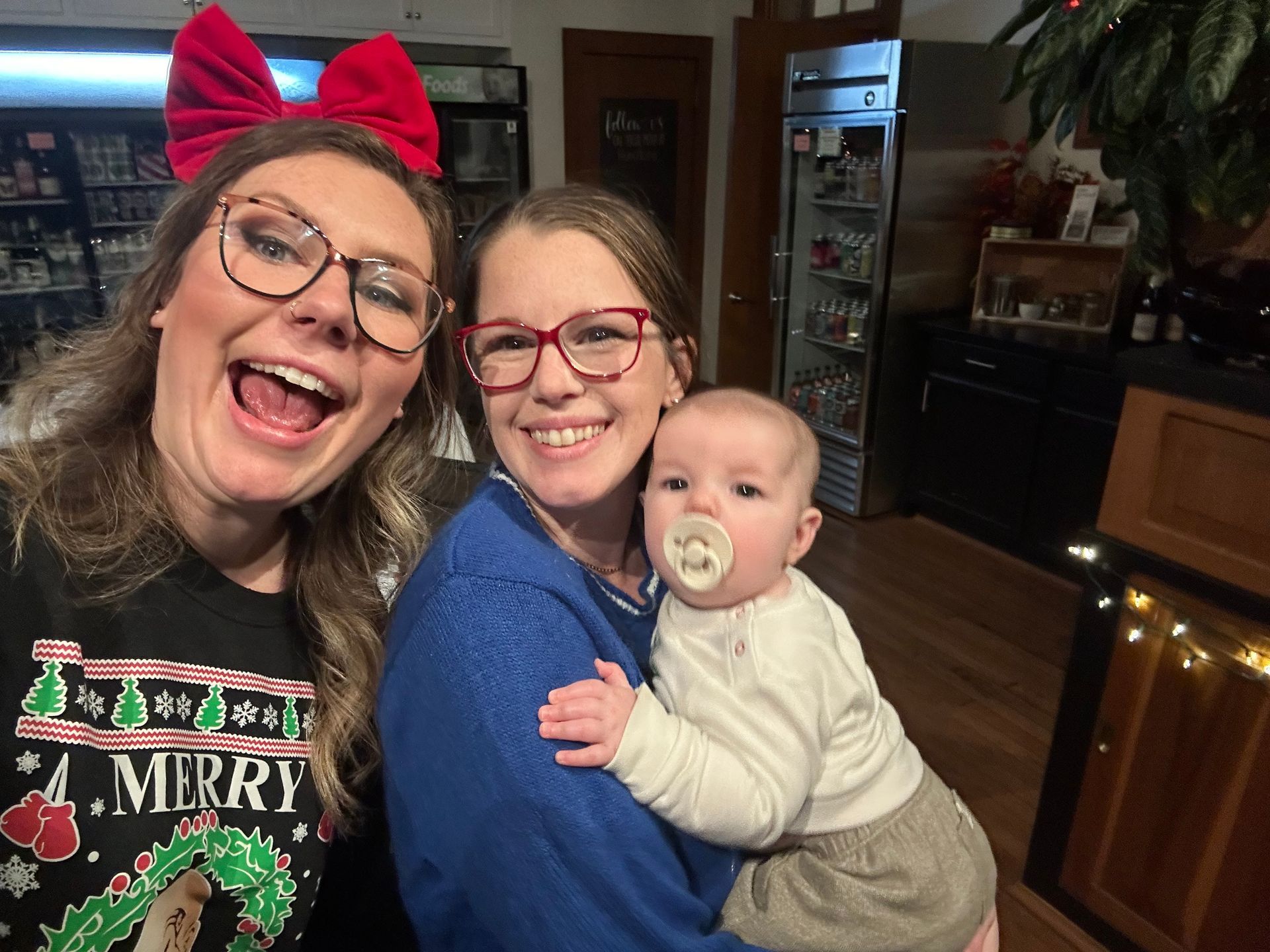 Image of RETEX team members' wives during team holiday dinner in December 2023.