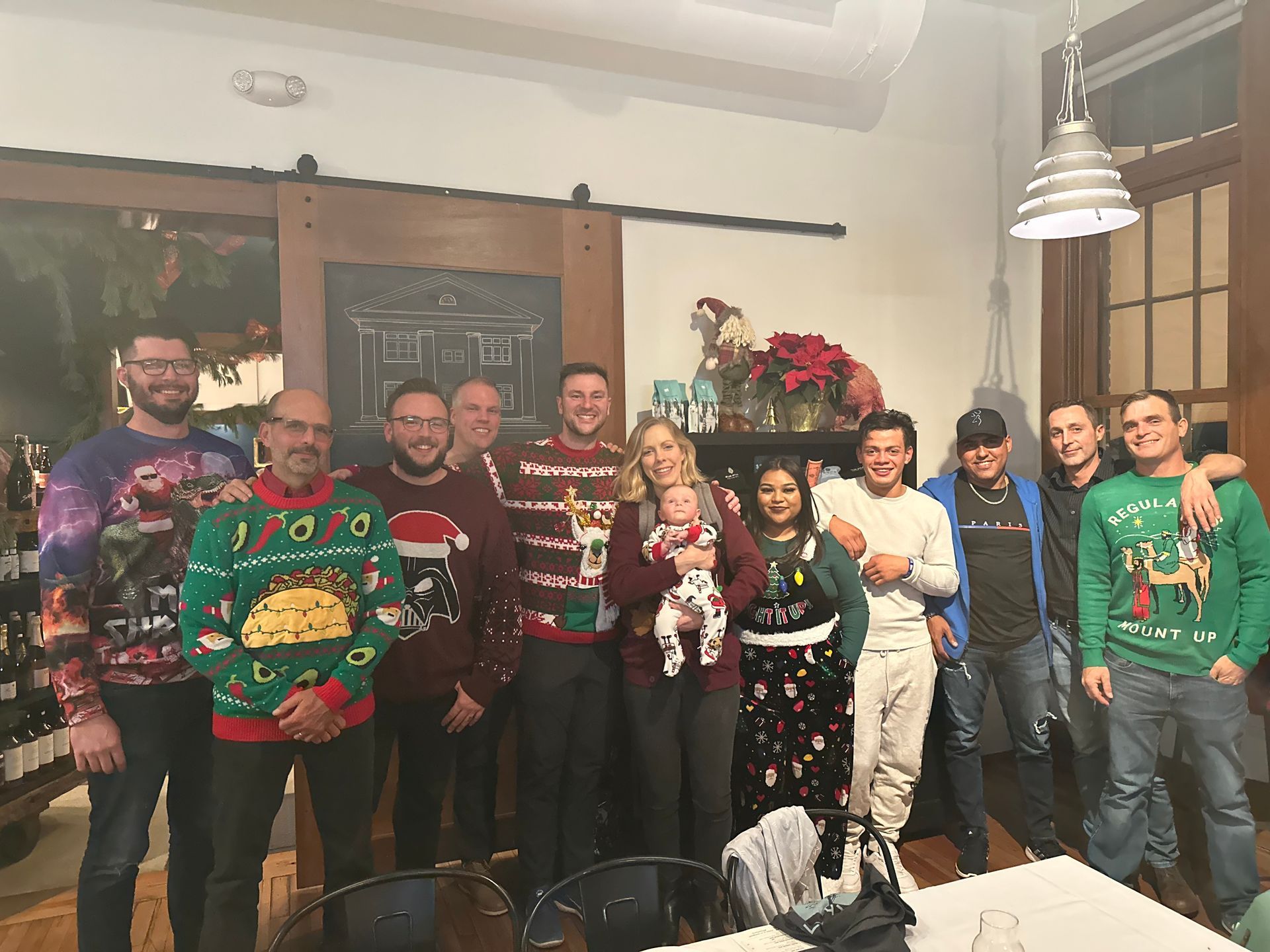 Image of RETEX team members during team holiday dinner in December 2023.
