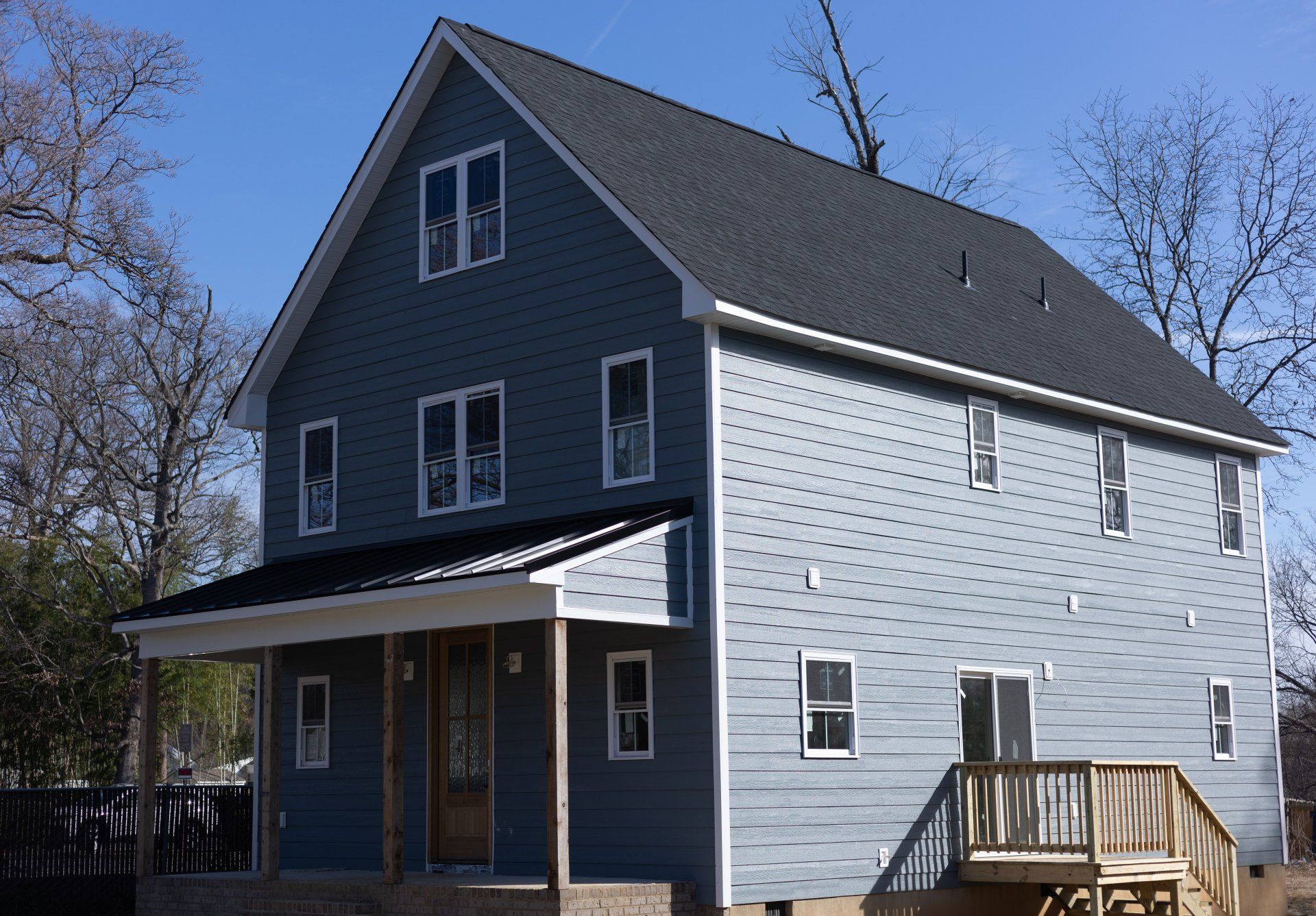 RETEX installed LP Smartside siding, seamless gutters, roof, and Provia windows on this new-construction Richmond VA home.