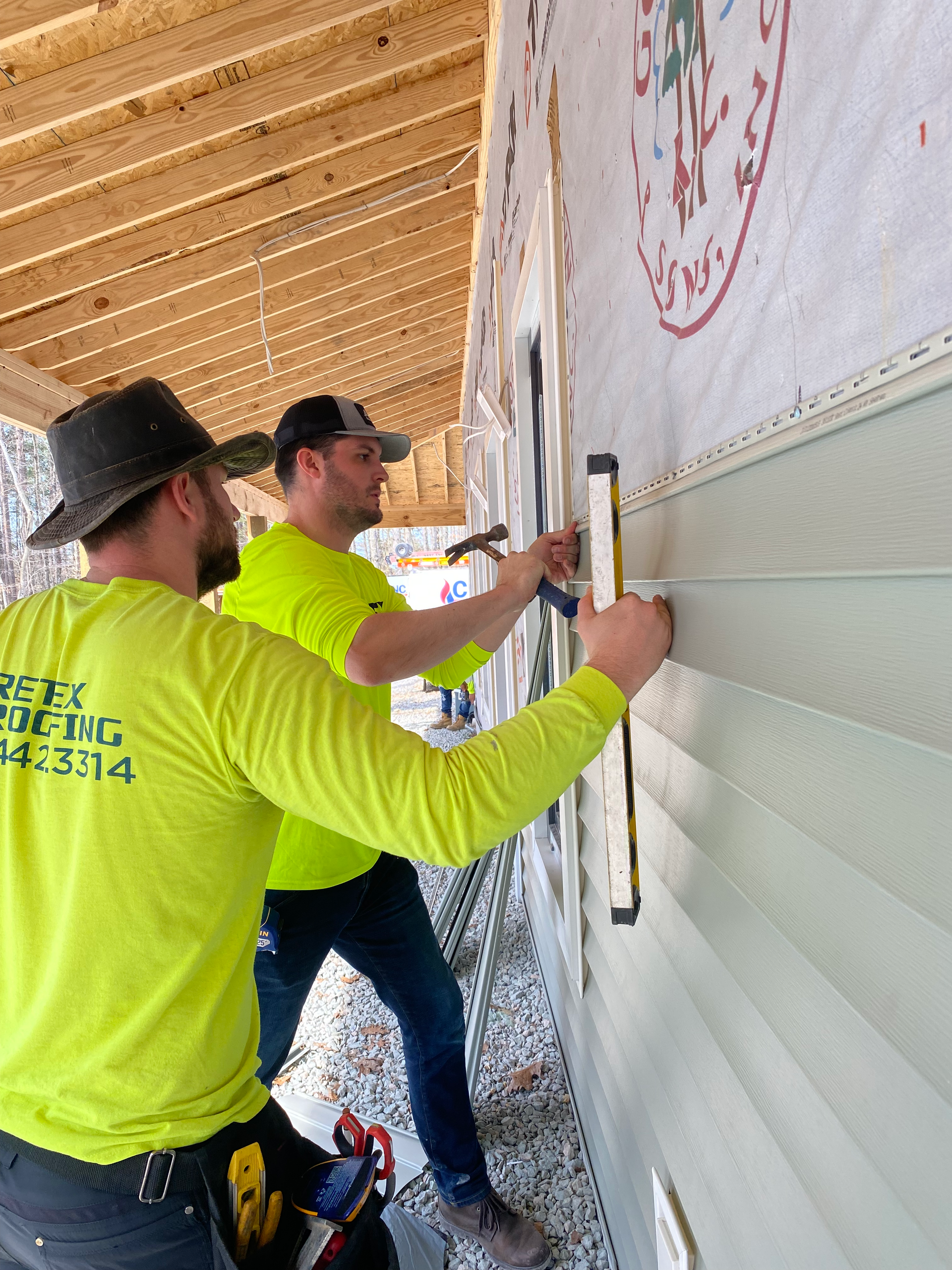 Image of RETEX’s Josh and Katelyn Lewis, Caleb Kammerling, Mark Erickson, and Caleb Hennon at Richmond Habitat for Humanity.