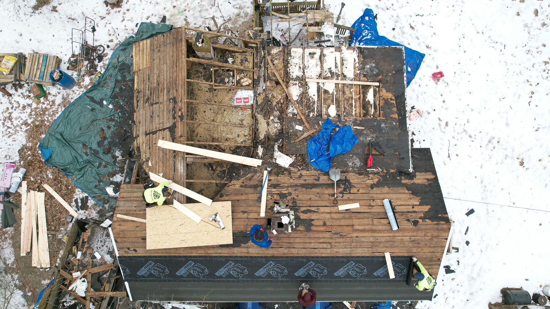 Aerial photo fo plywood and underlayment installation during Spotyslvania roof for a veteran project in January 2025.