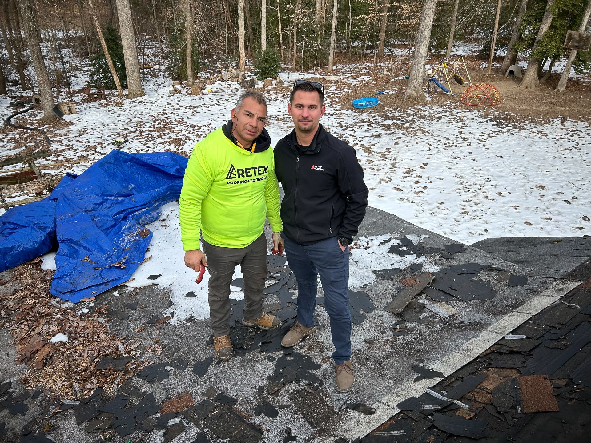 Photo of RETEX's Caleb Kammerling and crew member at Spotsylvania Roof for a Veteran rproject in January 2025.