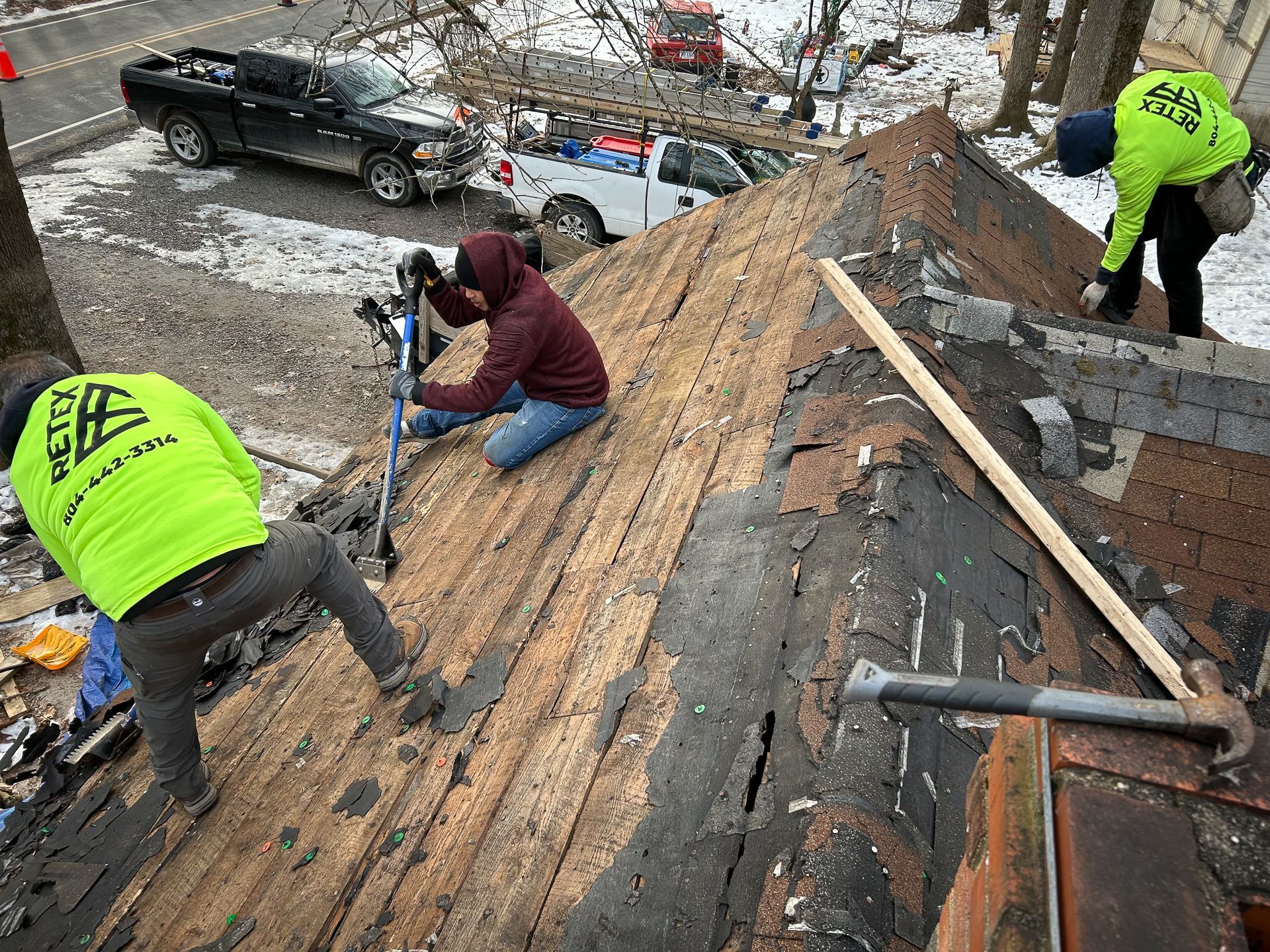 Photo of asphalt shingle roof tear-off during Spotyslvania roof for a veteran project in January 2025.