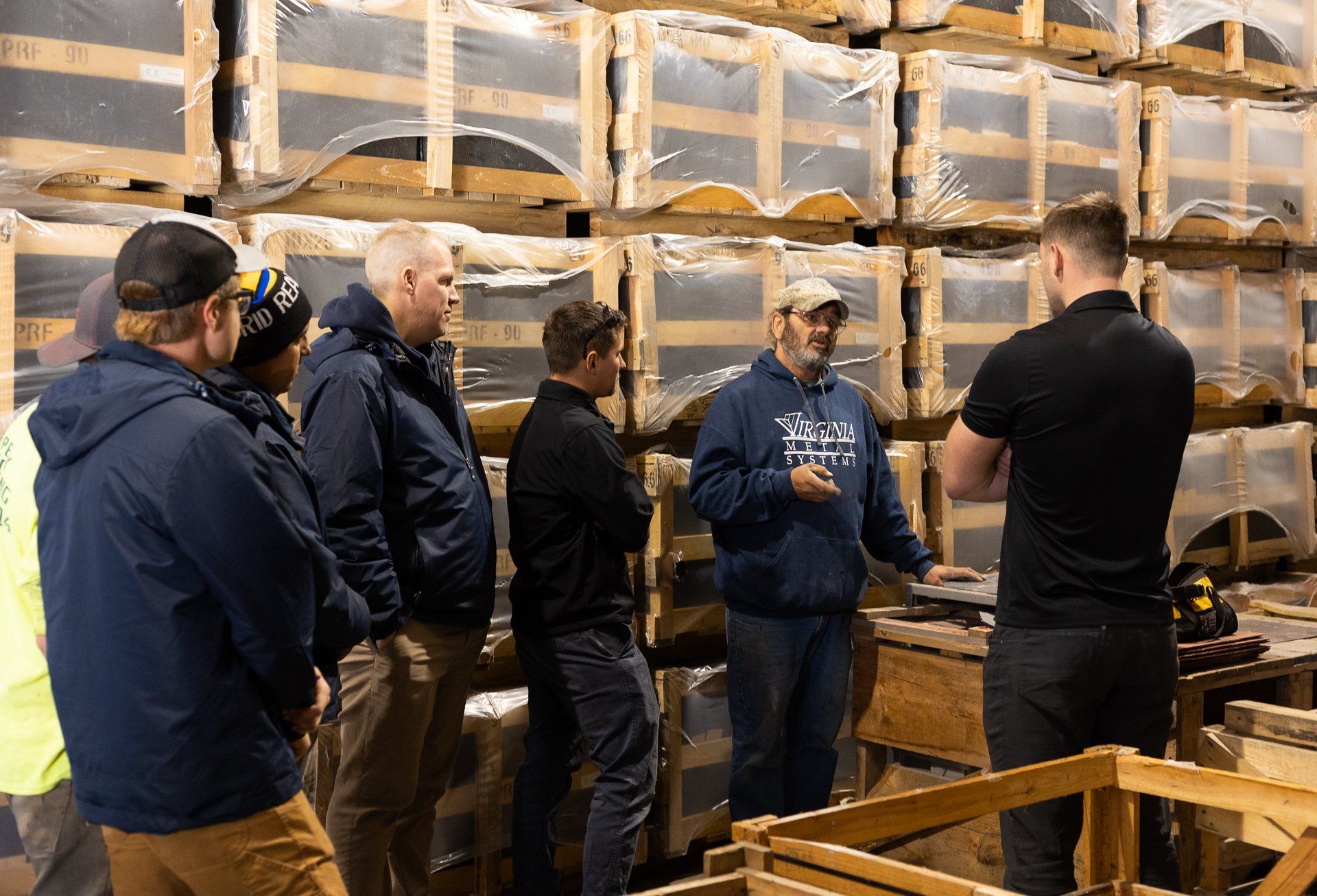 An image of RETEX's sales team learning about natural slate with a manufacturer during a team training event.